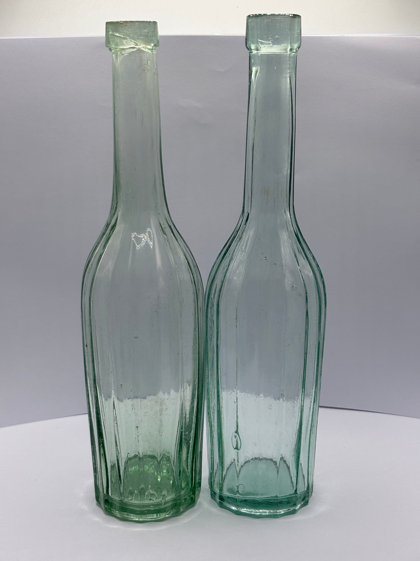 2 old aqua glass chemist bottles