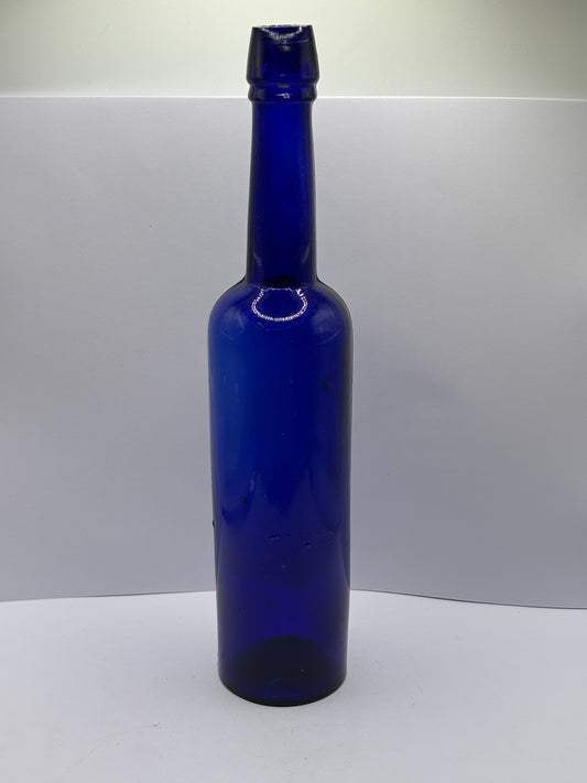Tall blue castor oil bottle 24cms