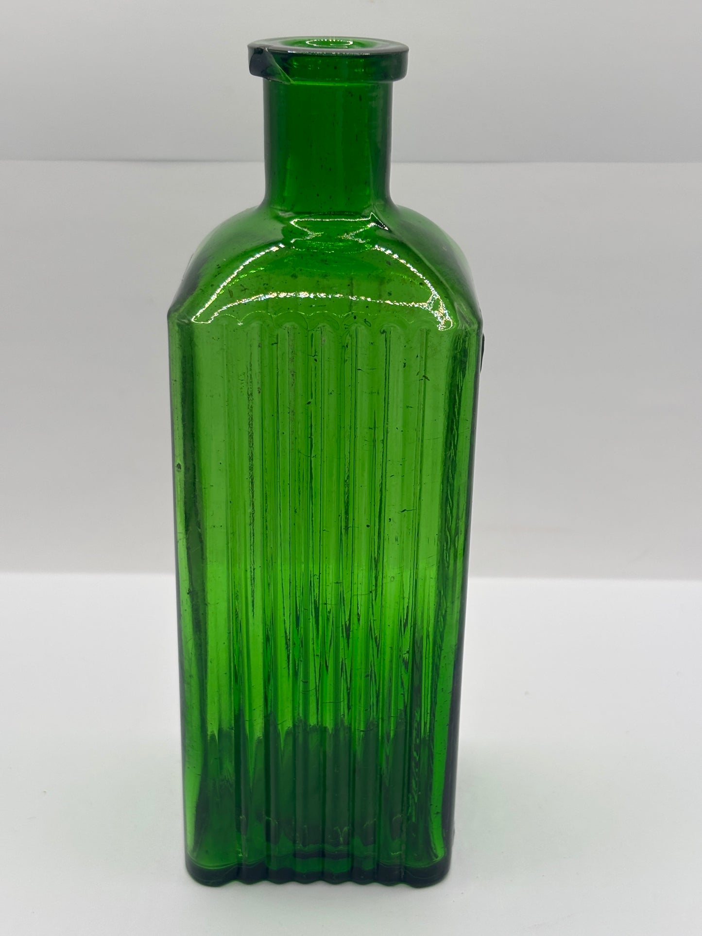 Old green glass poison bottle, Sheffield corporation poison bottle. Chipped