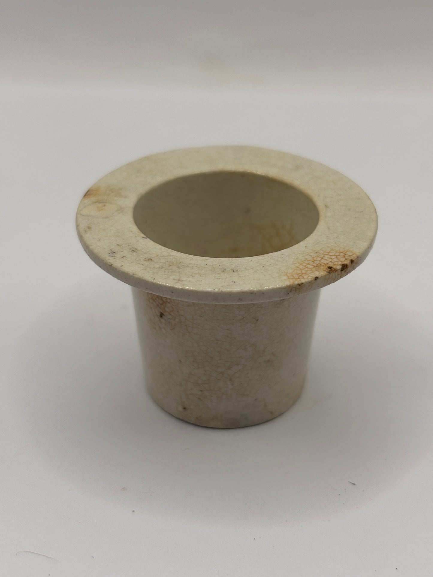 Old white stoneware school desk inkwell