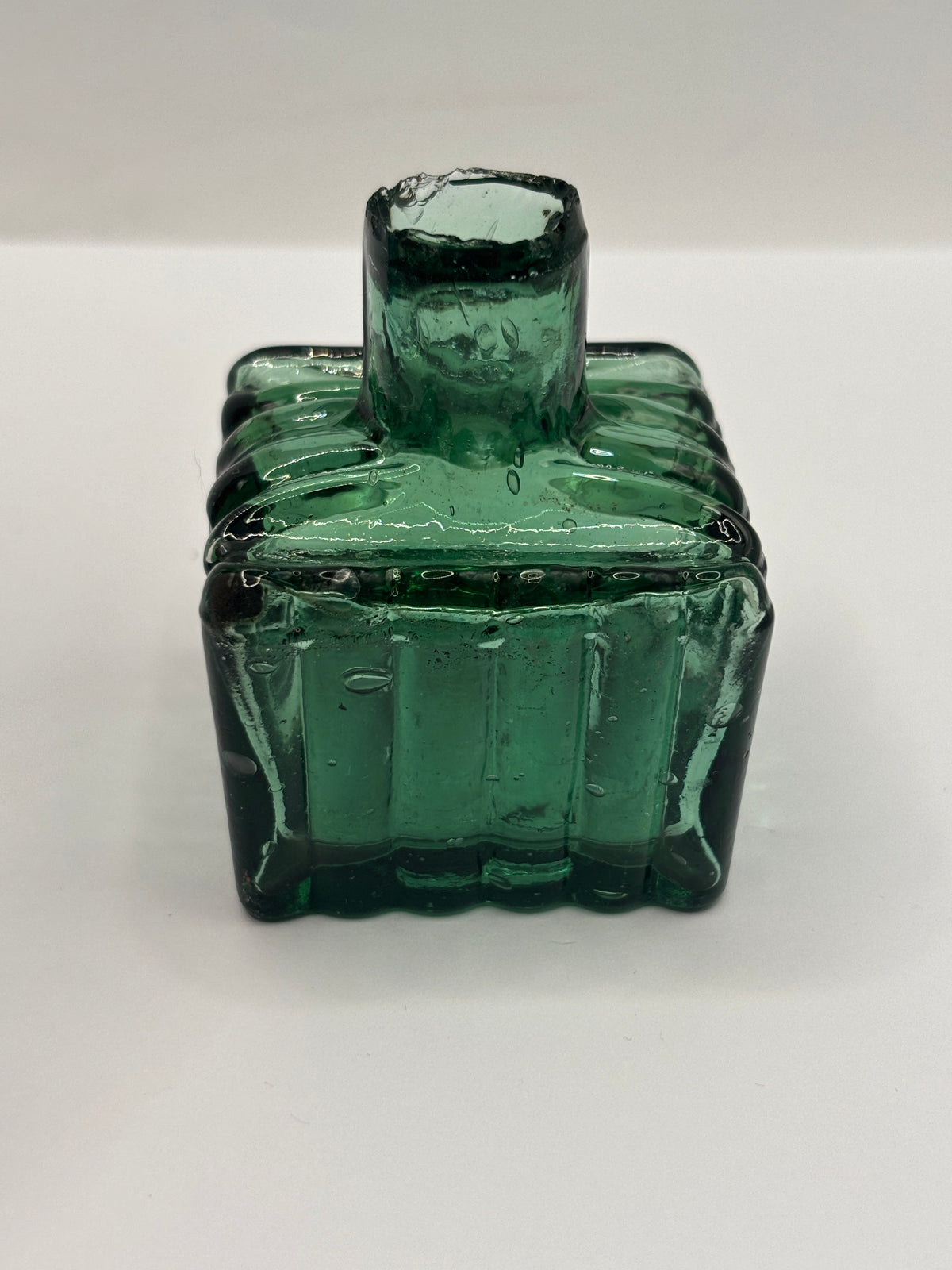 Old dark green glass inkwell, ink bottle, penny ink