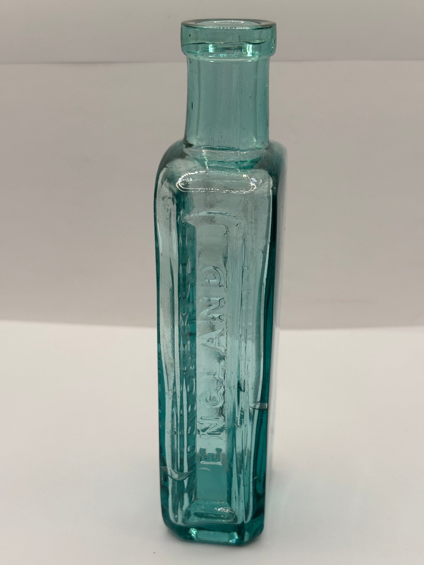 Old advertising aqua glass chemist bottle, Whittakers colour works