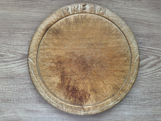 Old wooden carved bread board