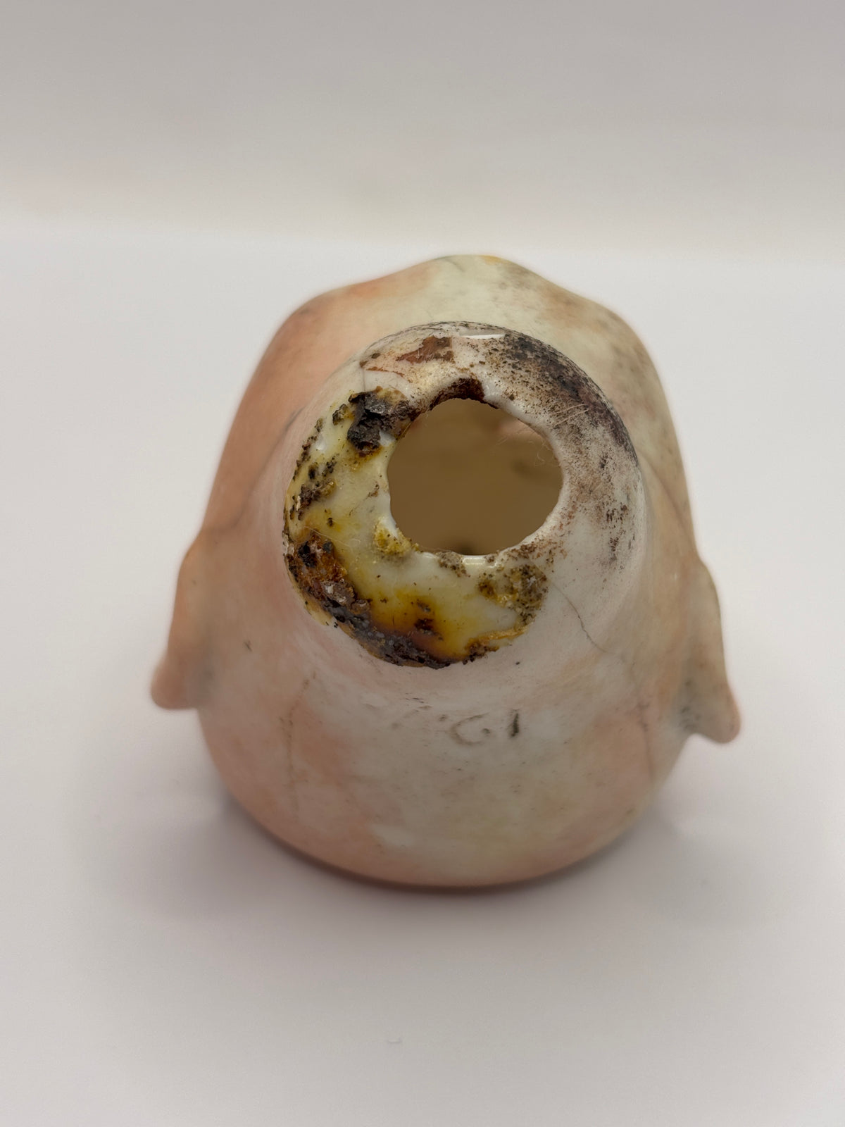 Old super stained bisque dolls head, damaged