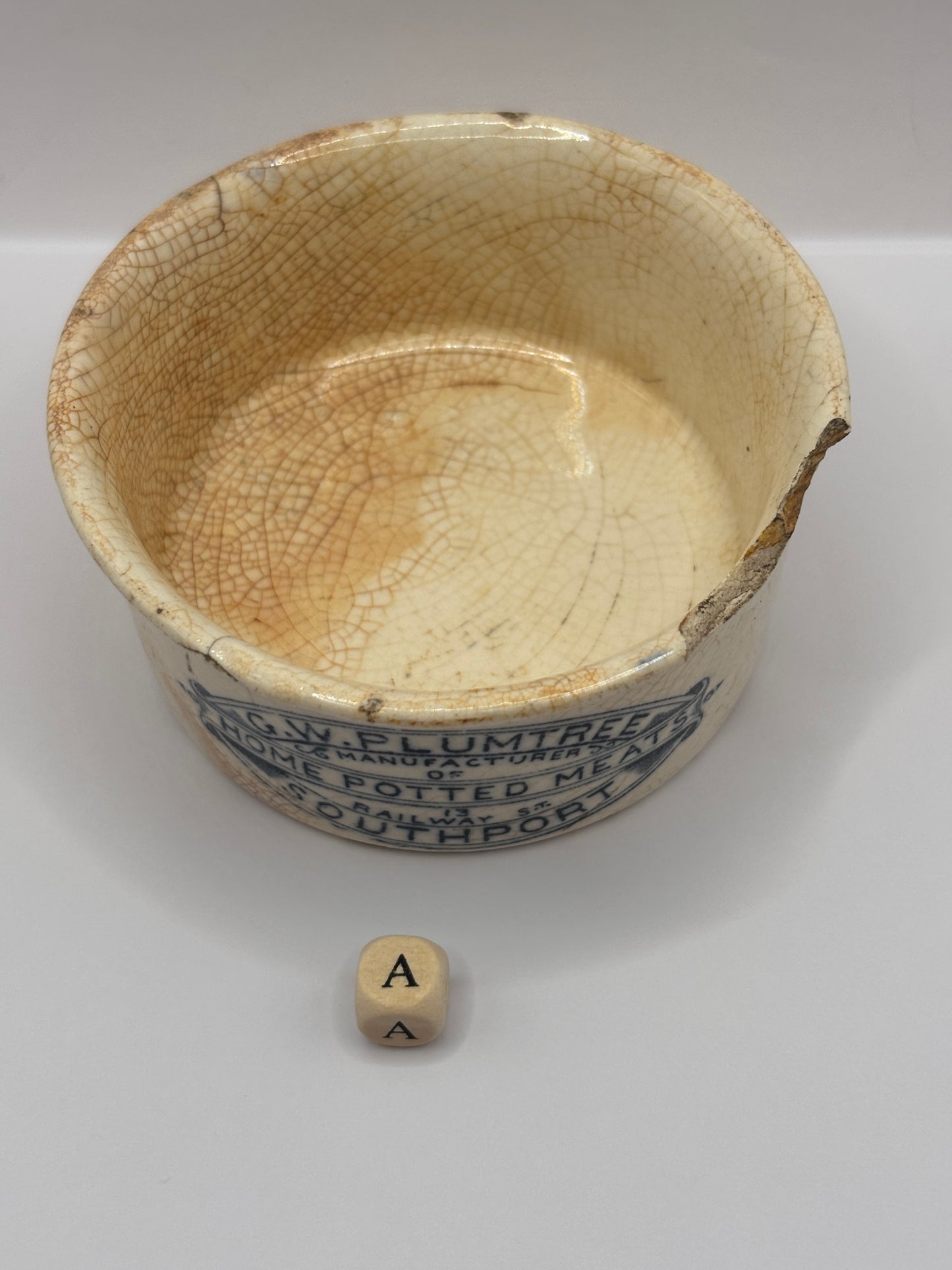Old advertising meat paste pot, plumtrees (a) damaged