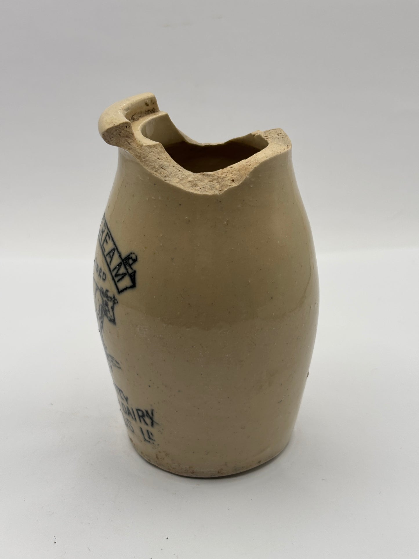 Old advertising cream pot,Woodlands dairy. DAMAGED