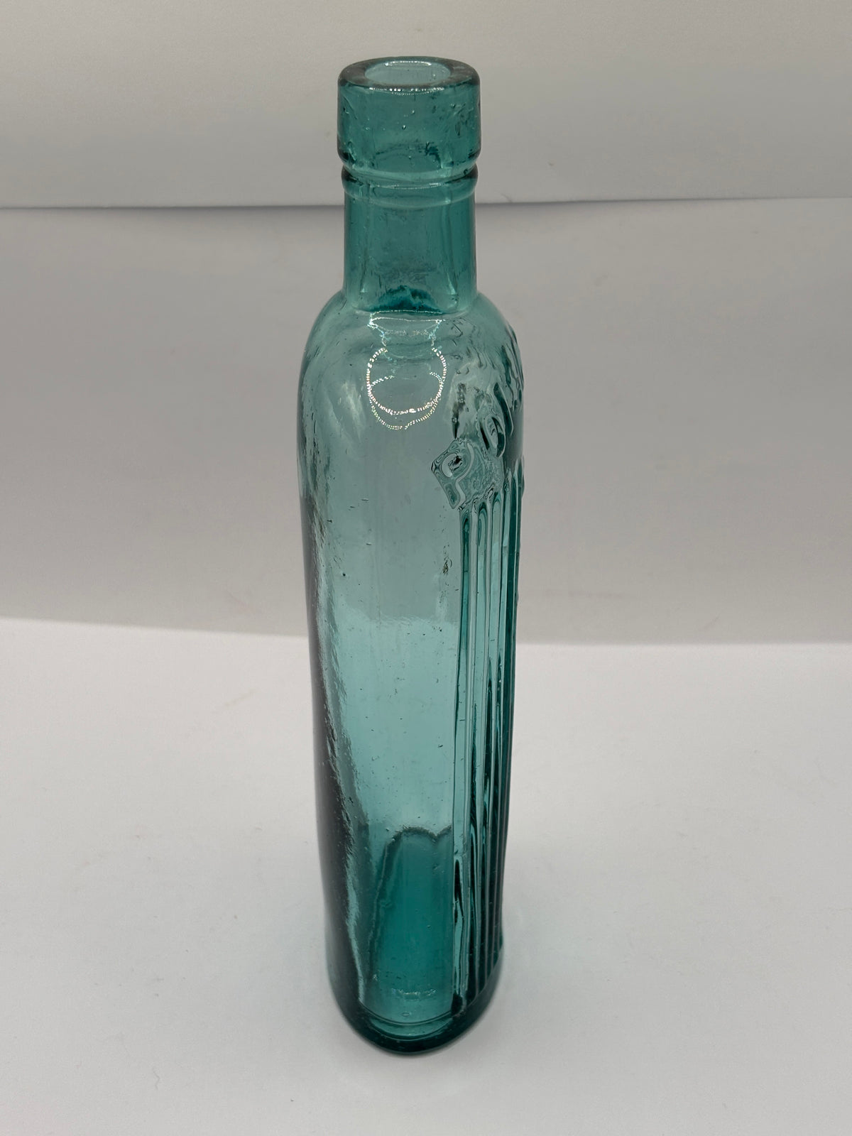 Old aqua glass poison bottle, POISONOUS not to be taken
