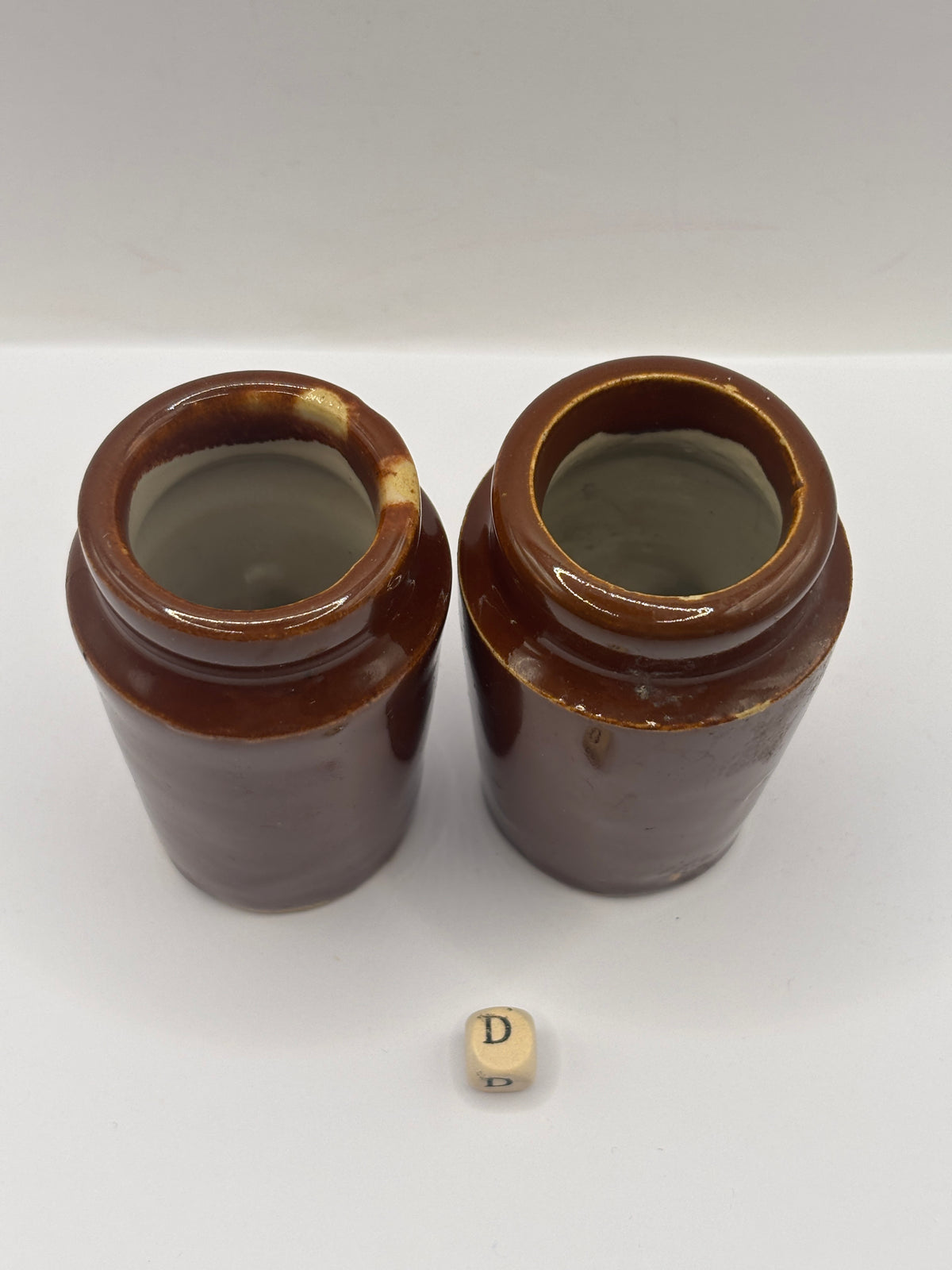 2 Old brown stoneware cream pots (D)