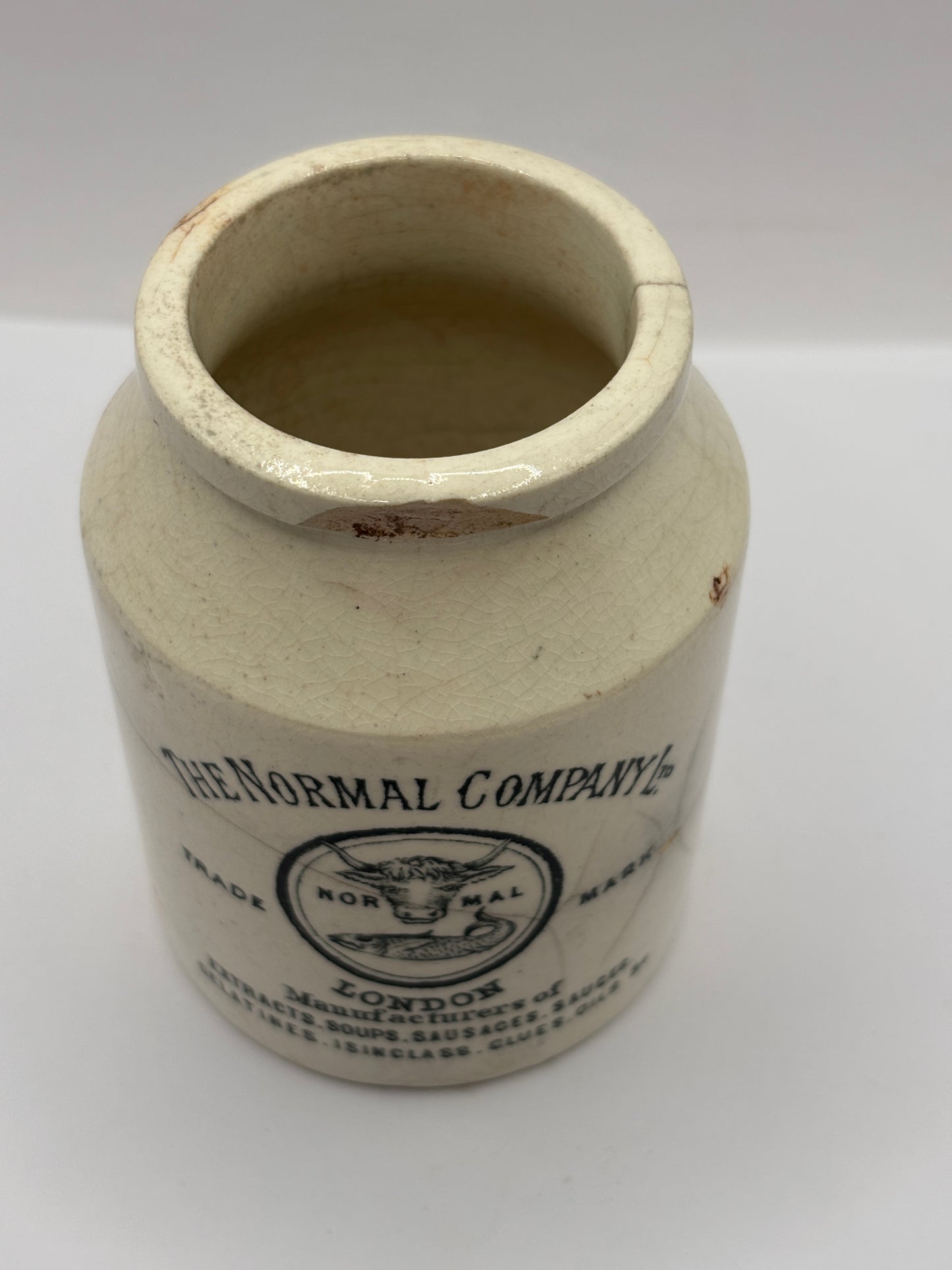 Old advertising jar, The normal company, London. Damaged