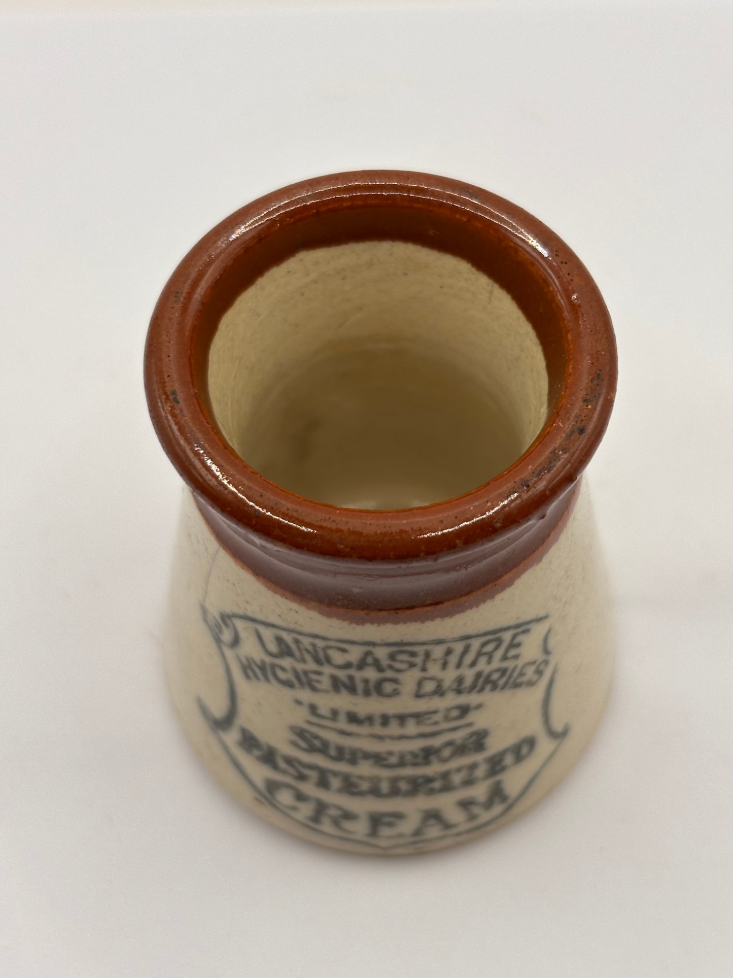 Old stoneware advertising cream pot, Lancashire hygienic dairies. Hairlines