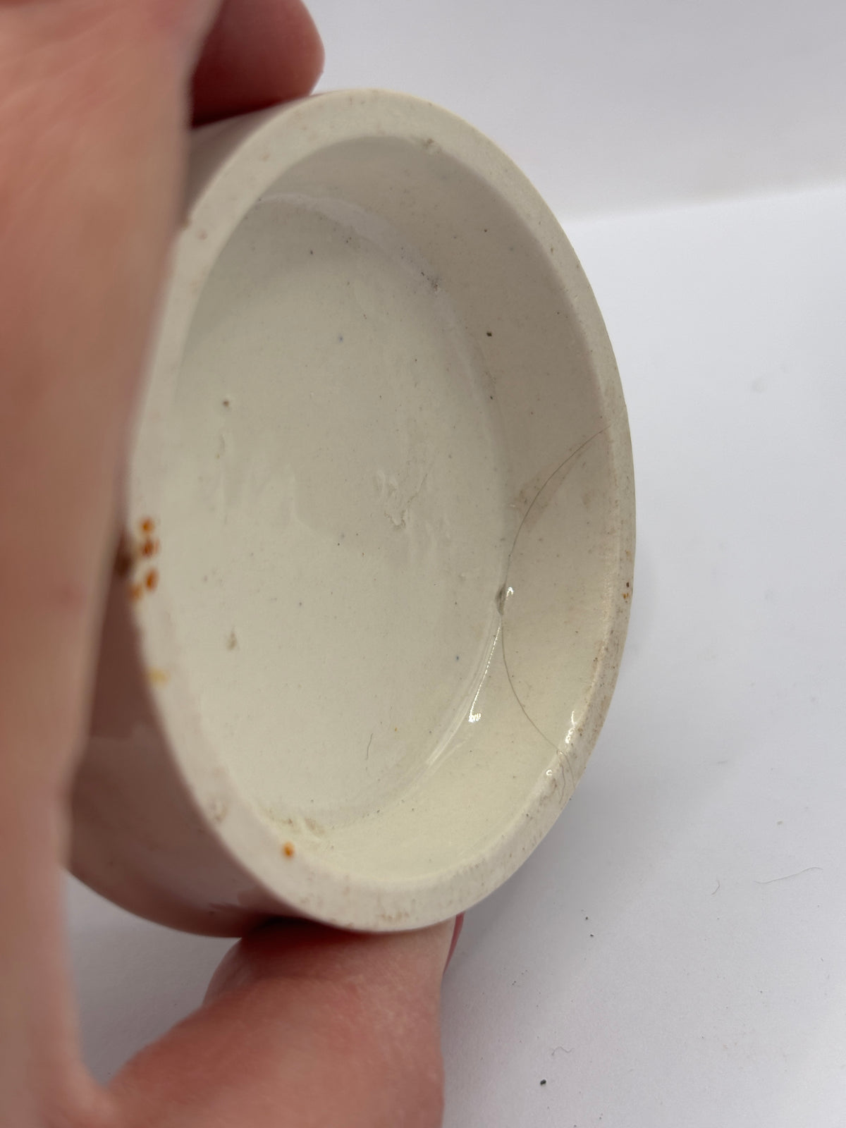 Old advertising lid and base. Woods areca nut tooth paste. Damaged