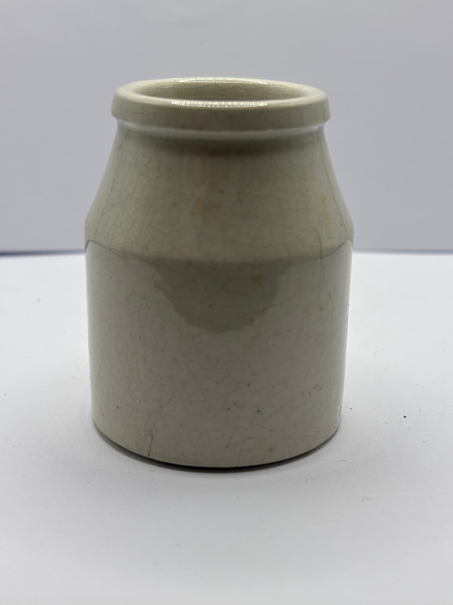 Old white stoneware jar, creamer, churn