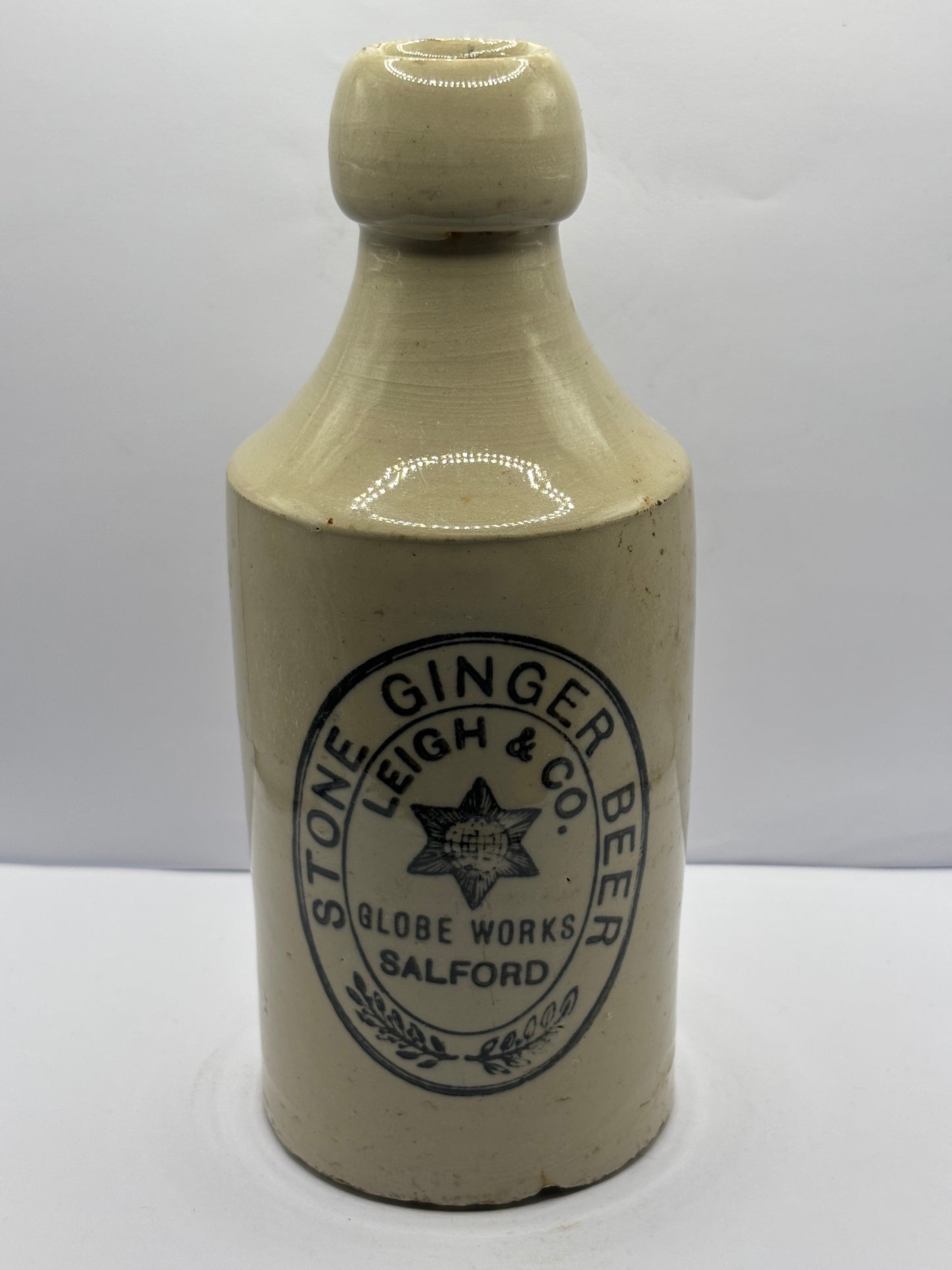 Old stoneware ginger beer bottle, Leigh & Co Salford