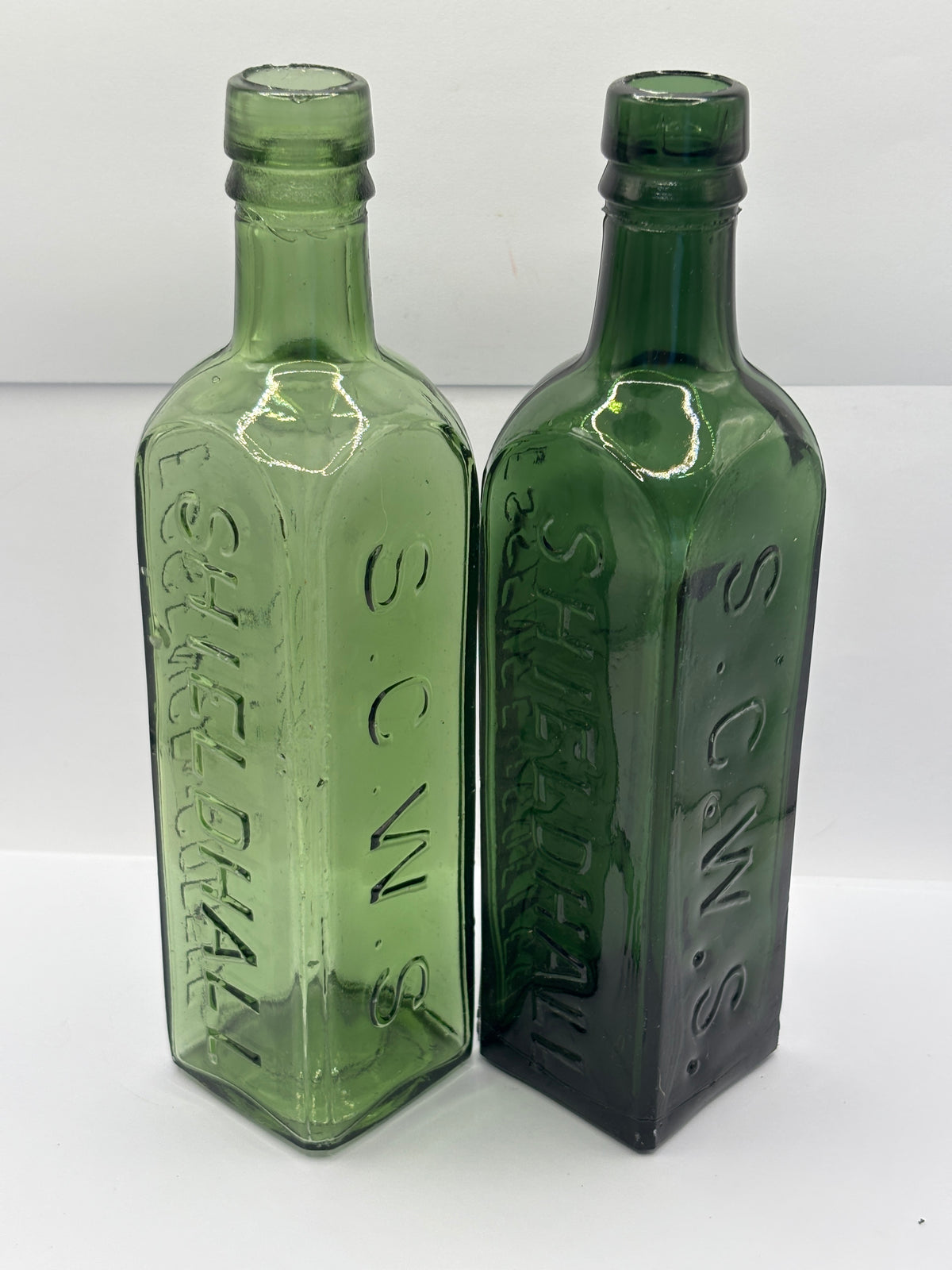 2 Old green glass essence of coffee & chicory bottles