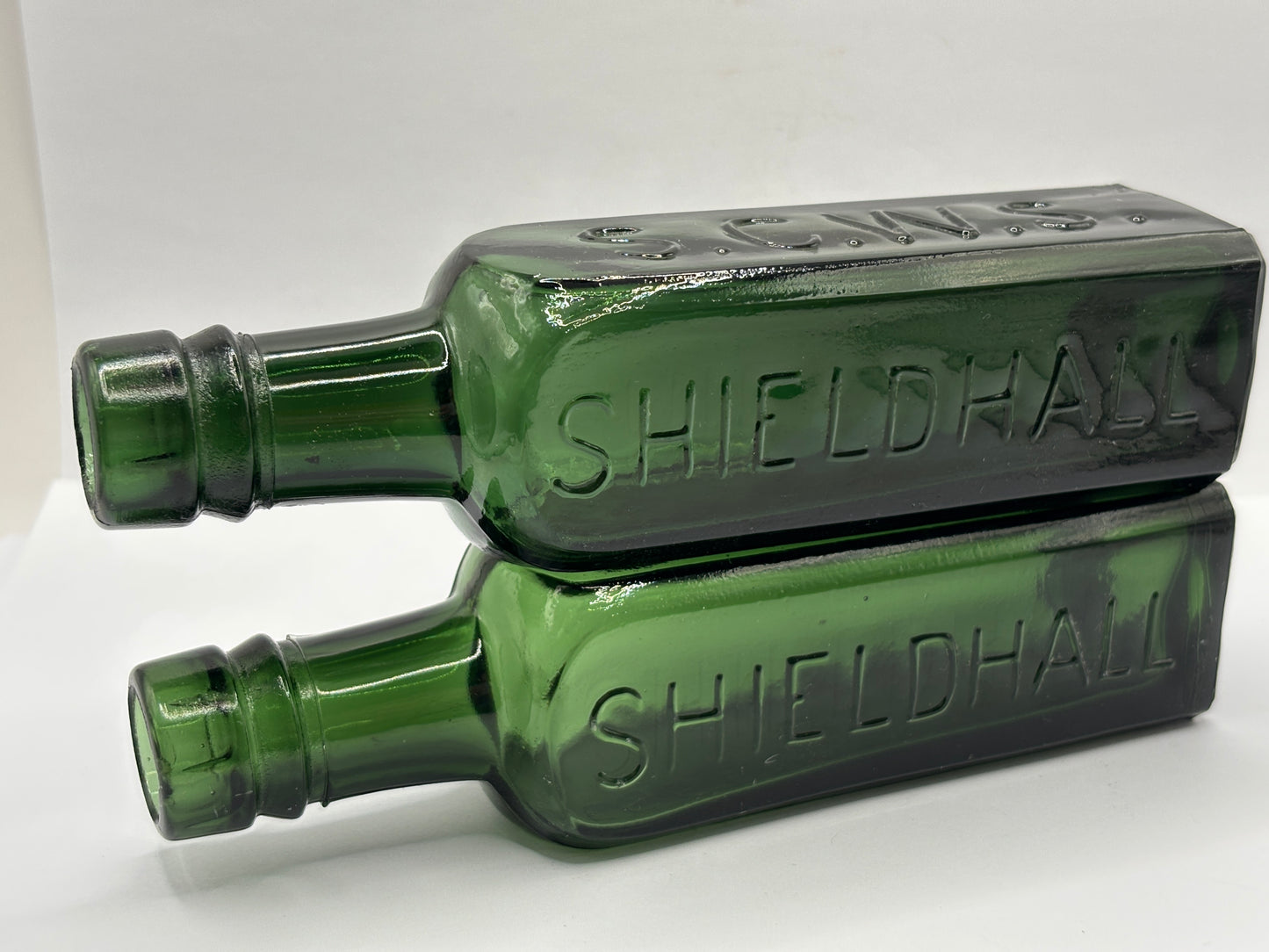 2 old green glass coffee essence bottles