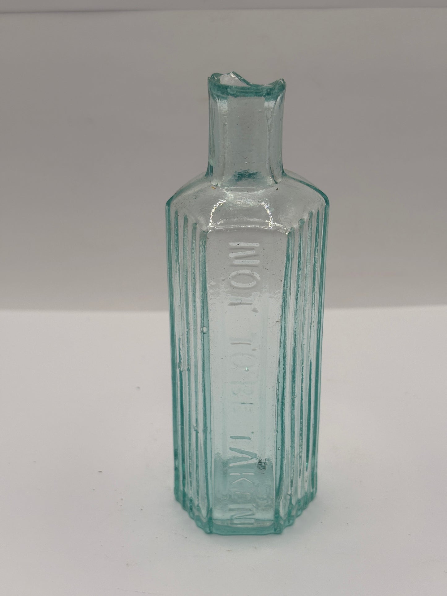 Old aqua glass poison bottle, not to be taken