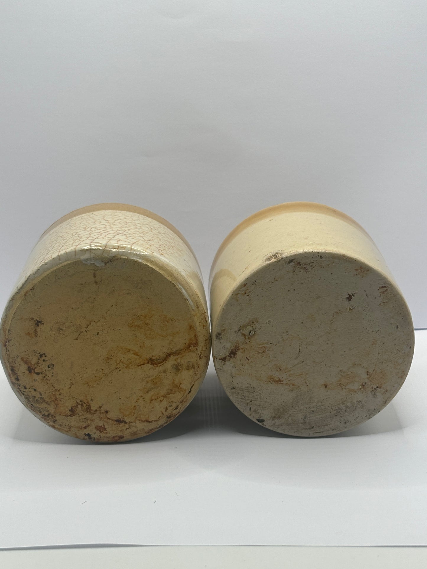 2 small stoneware jars