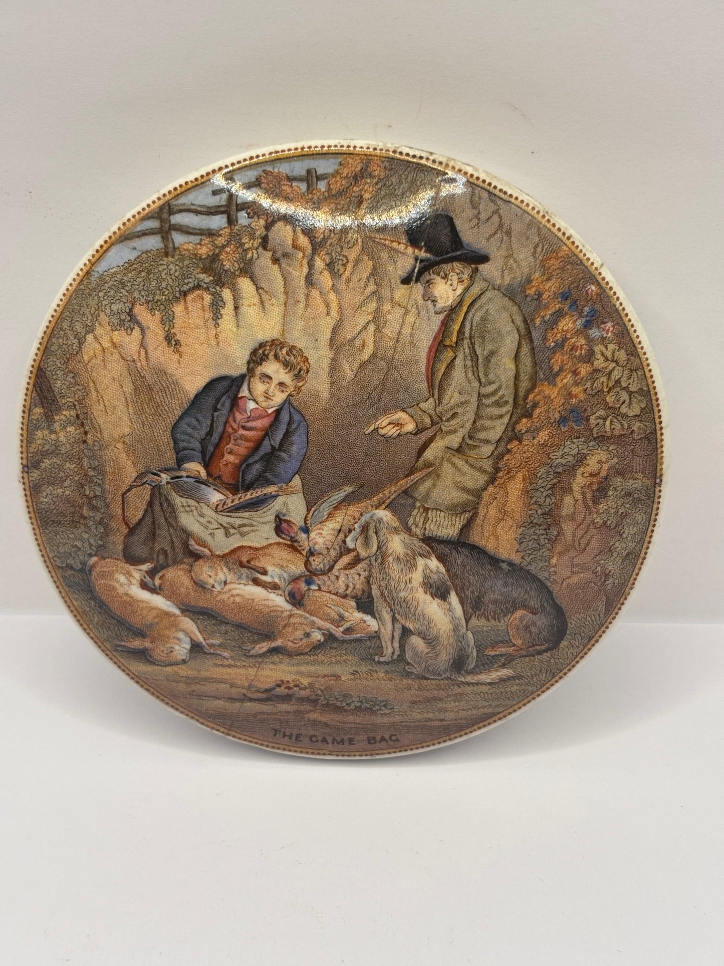 Old Prattware lid, The game bag. Damaged