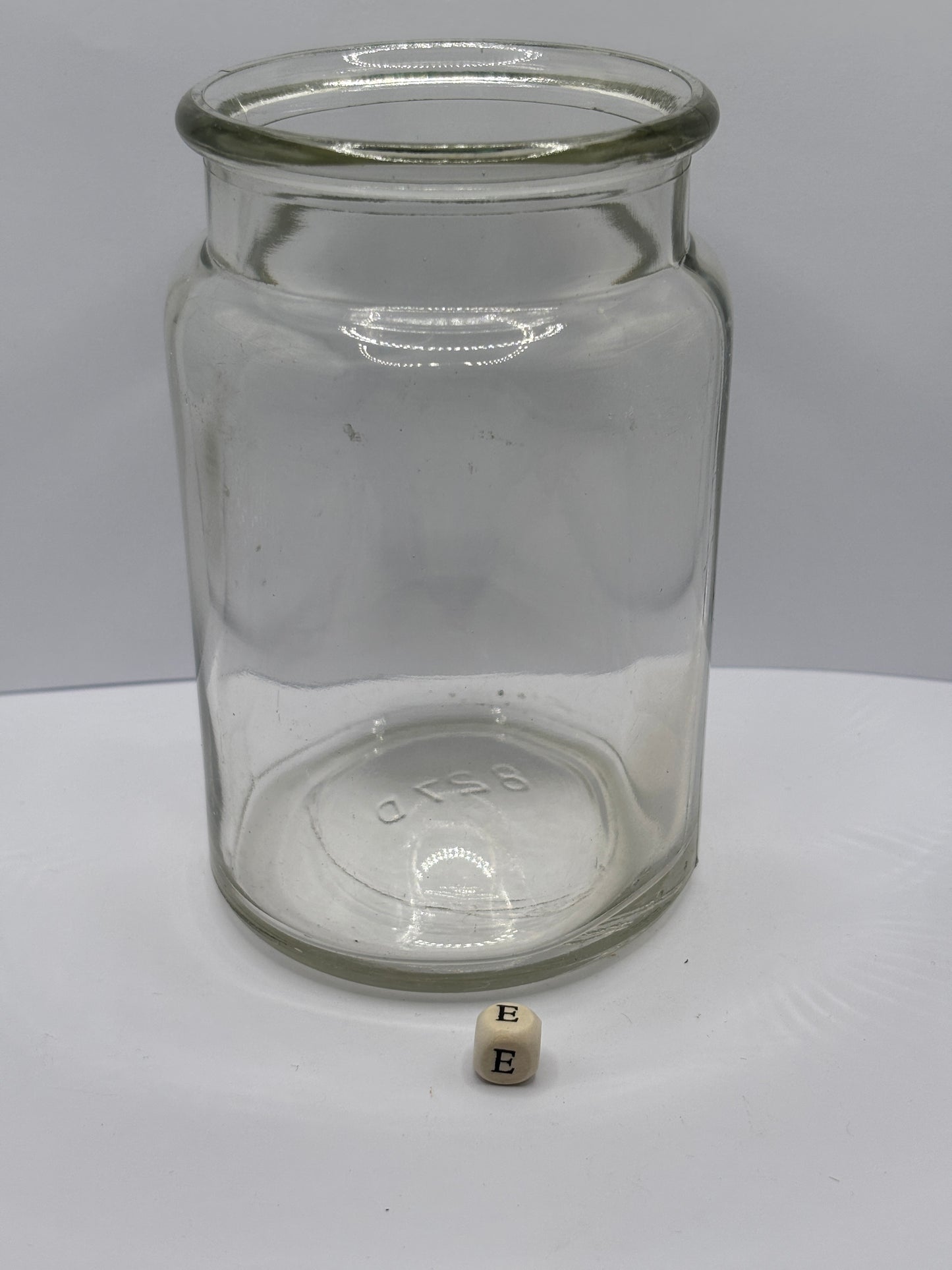 Old clear glass jam jar (e)