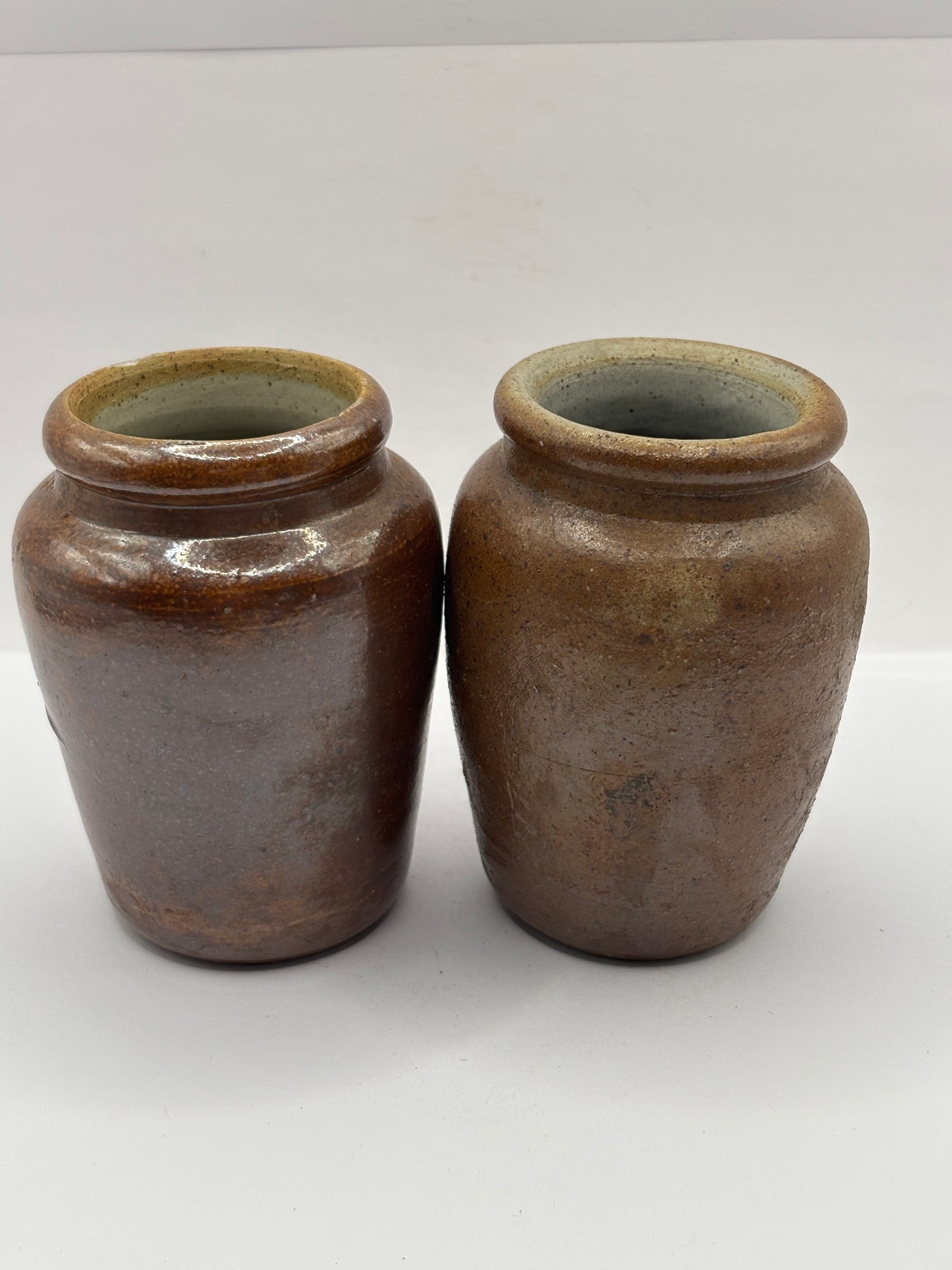 2 old brown stoneware cream pots