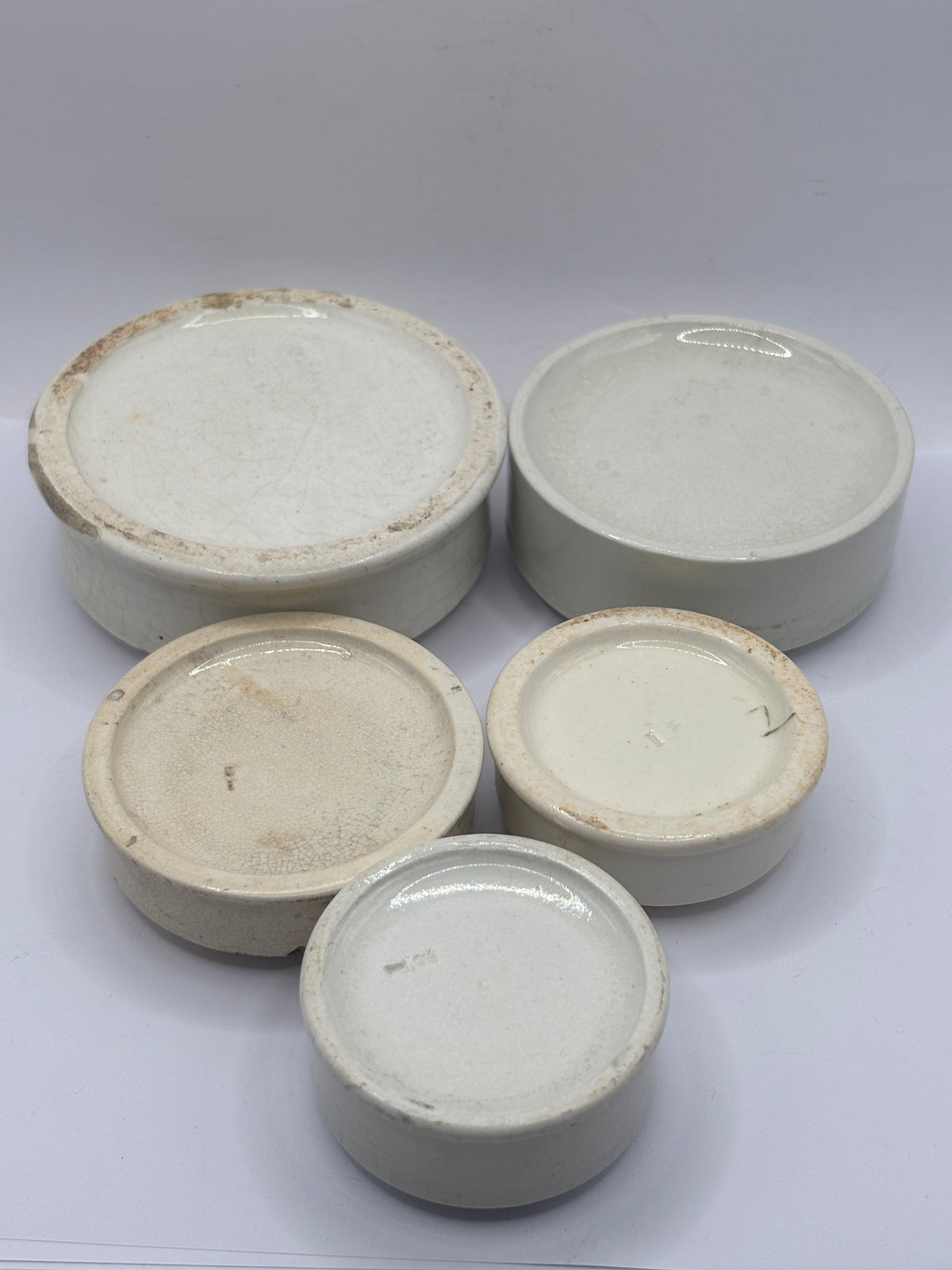 5 old stoneware pot lid bases, stackers (k)
