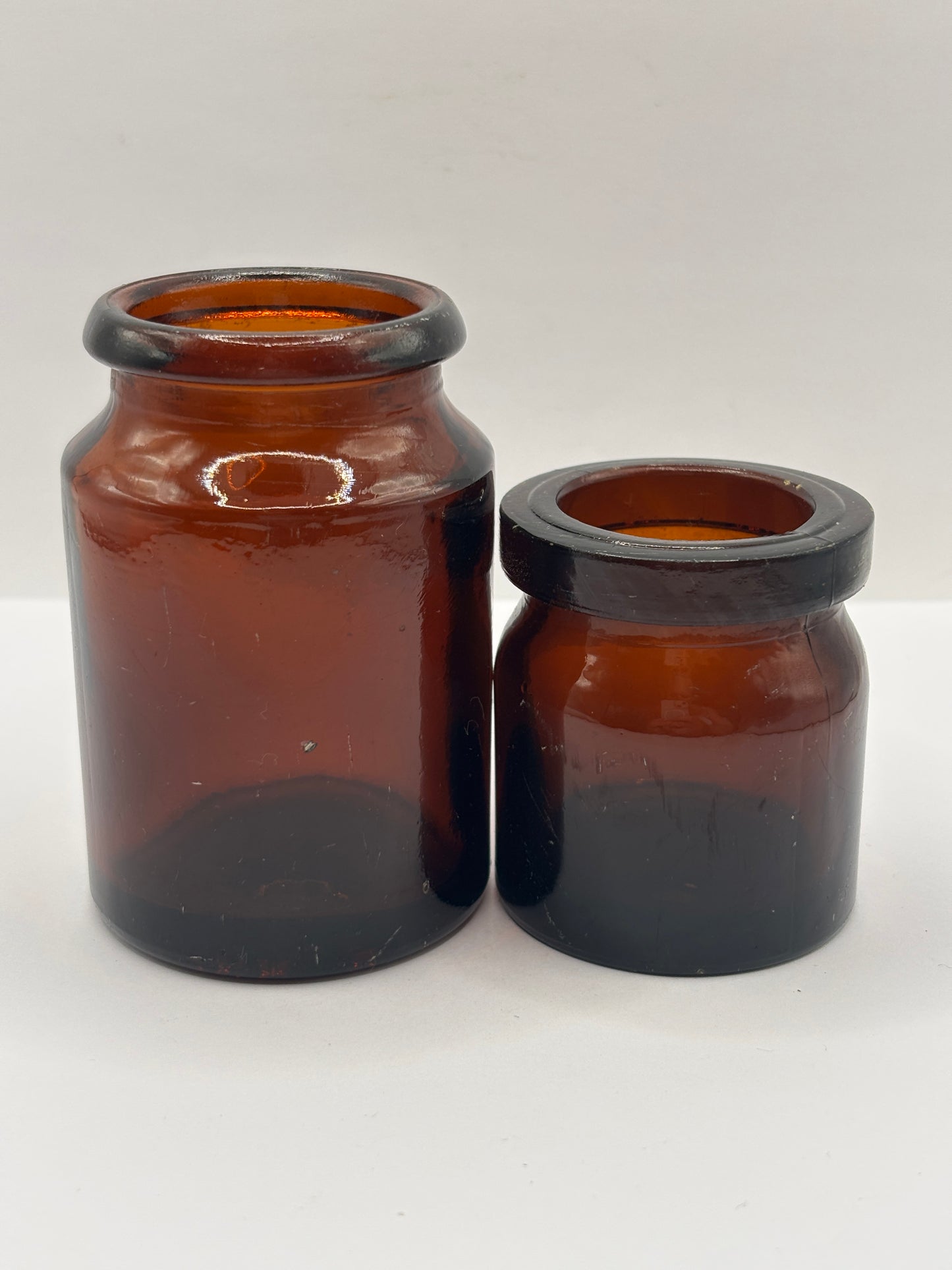 2 old amber glass jars