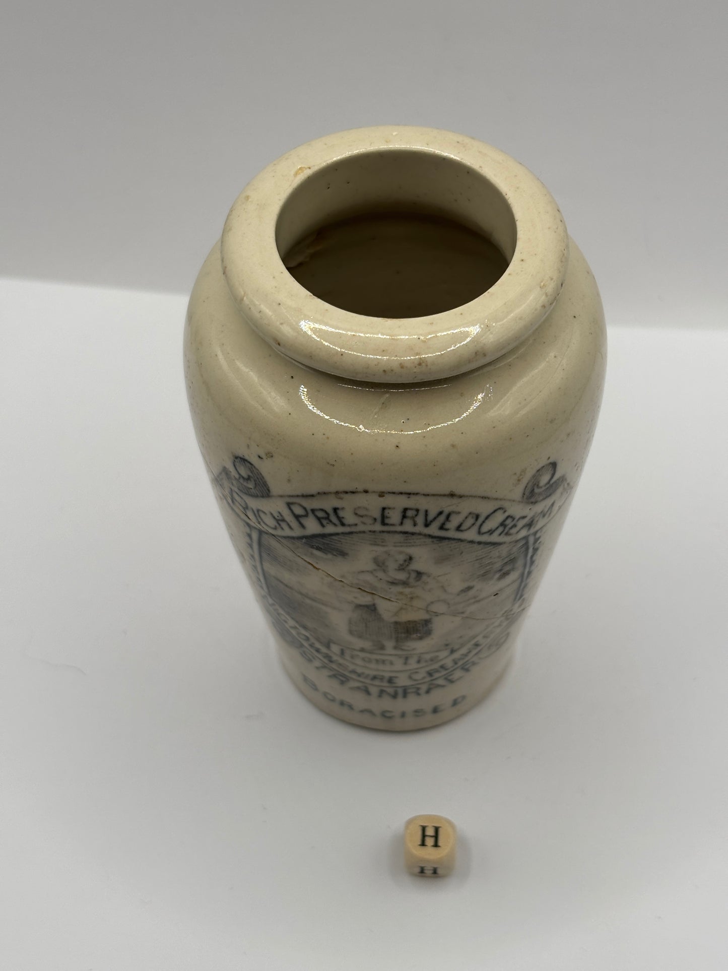 Old advertising cream pot, Rich preserved cream, Stranraer. Milk maid (H) damaged