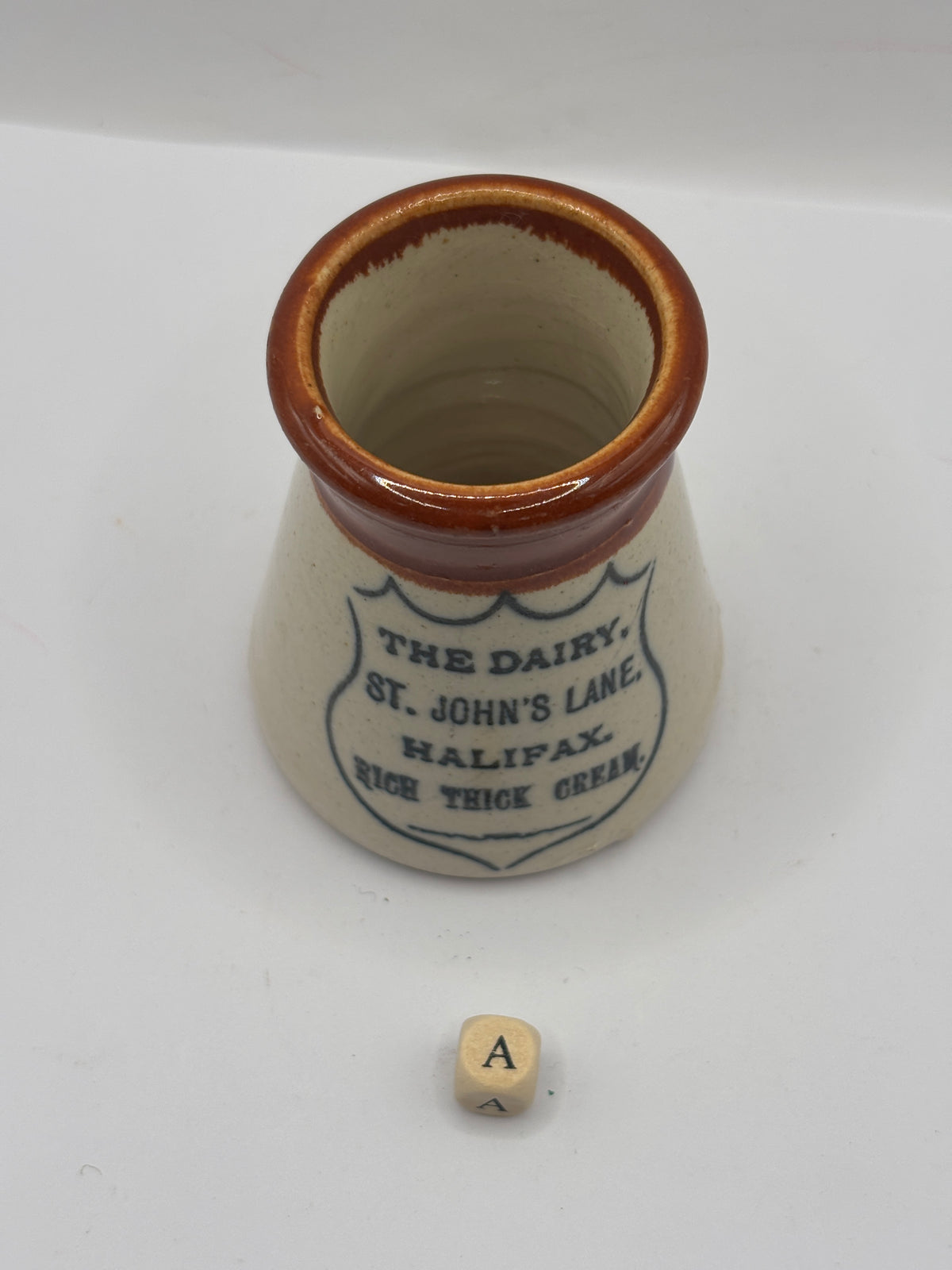 Old advertising cream pot, The dairy, Johns lane, Halifax (a)
