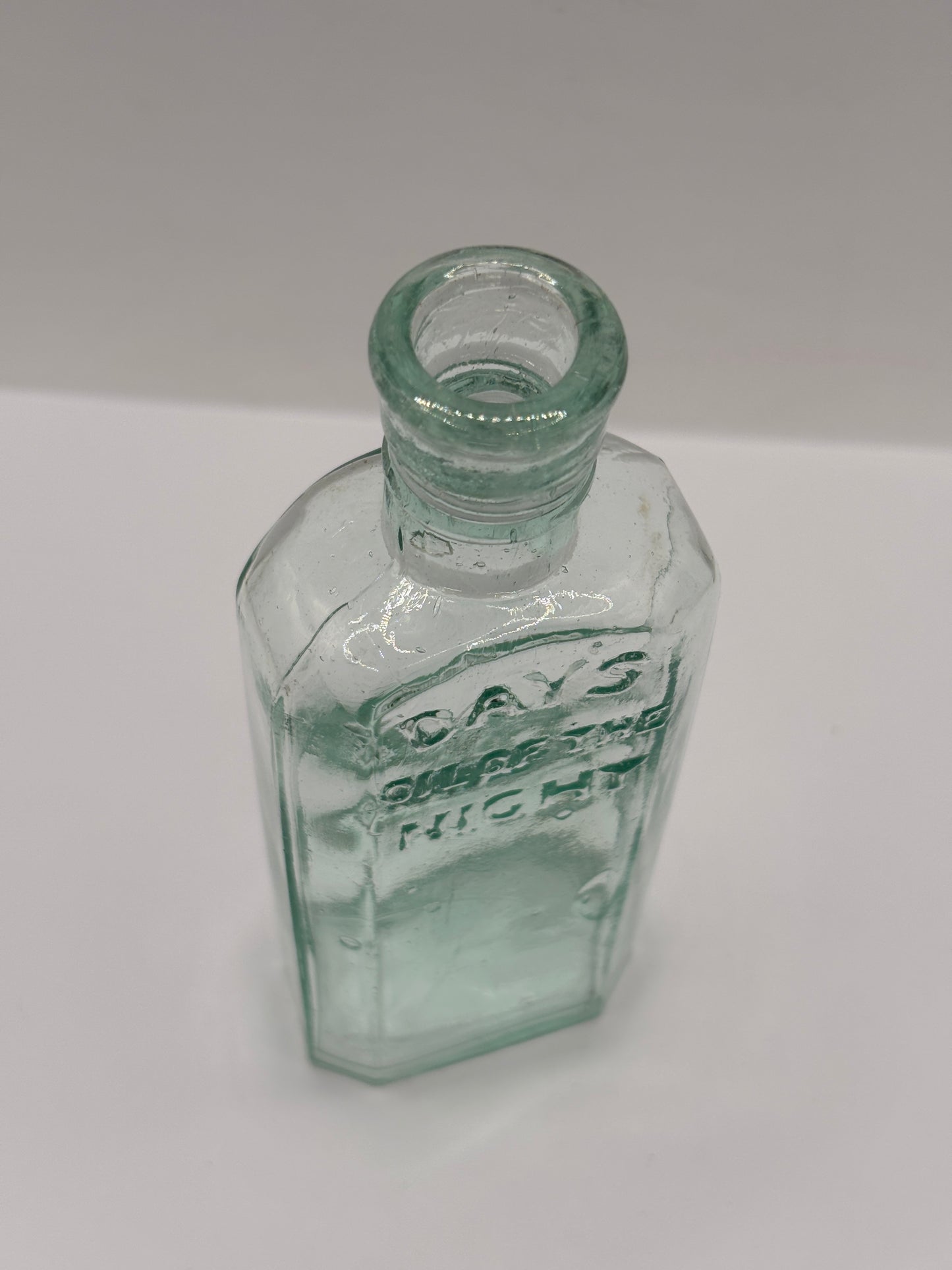 Old glass advertising chemist bottle, Days oil of the night