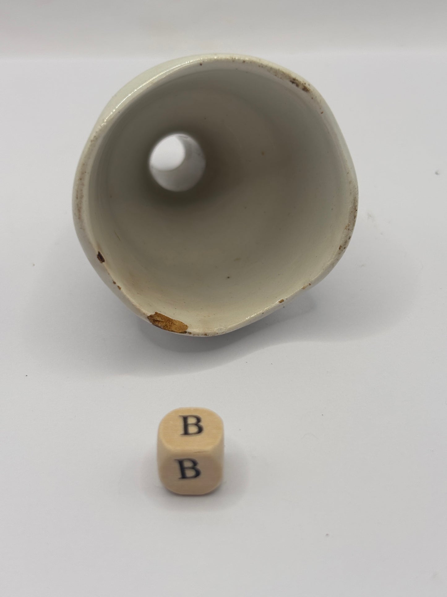 Old white stoneware pie funnel, stained & crazed. Chipped