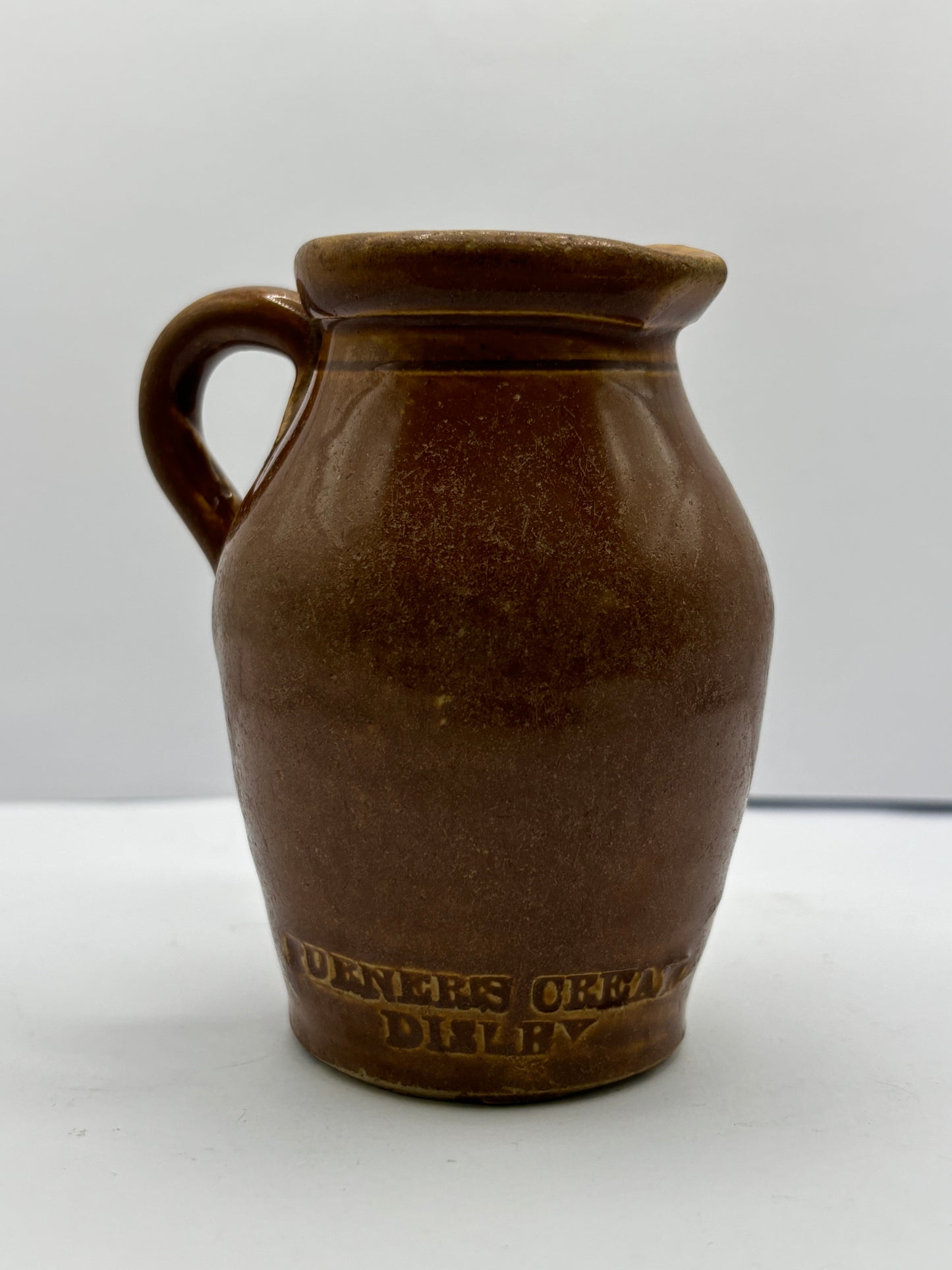 Old stoneware shop display cream pot. Turners cream Disley.