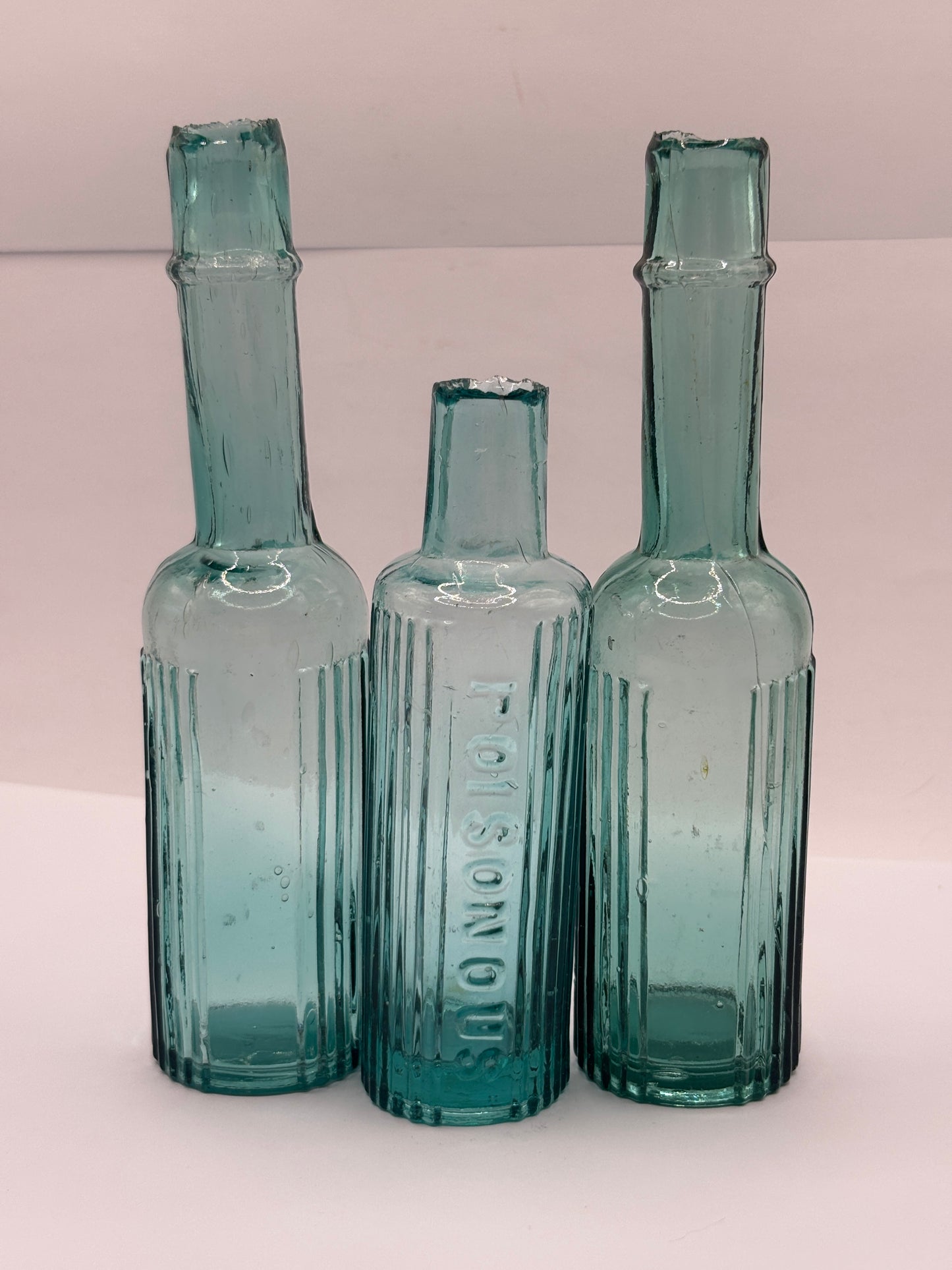3 Old aqua glass poison bottles, poisonous
