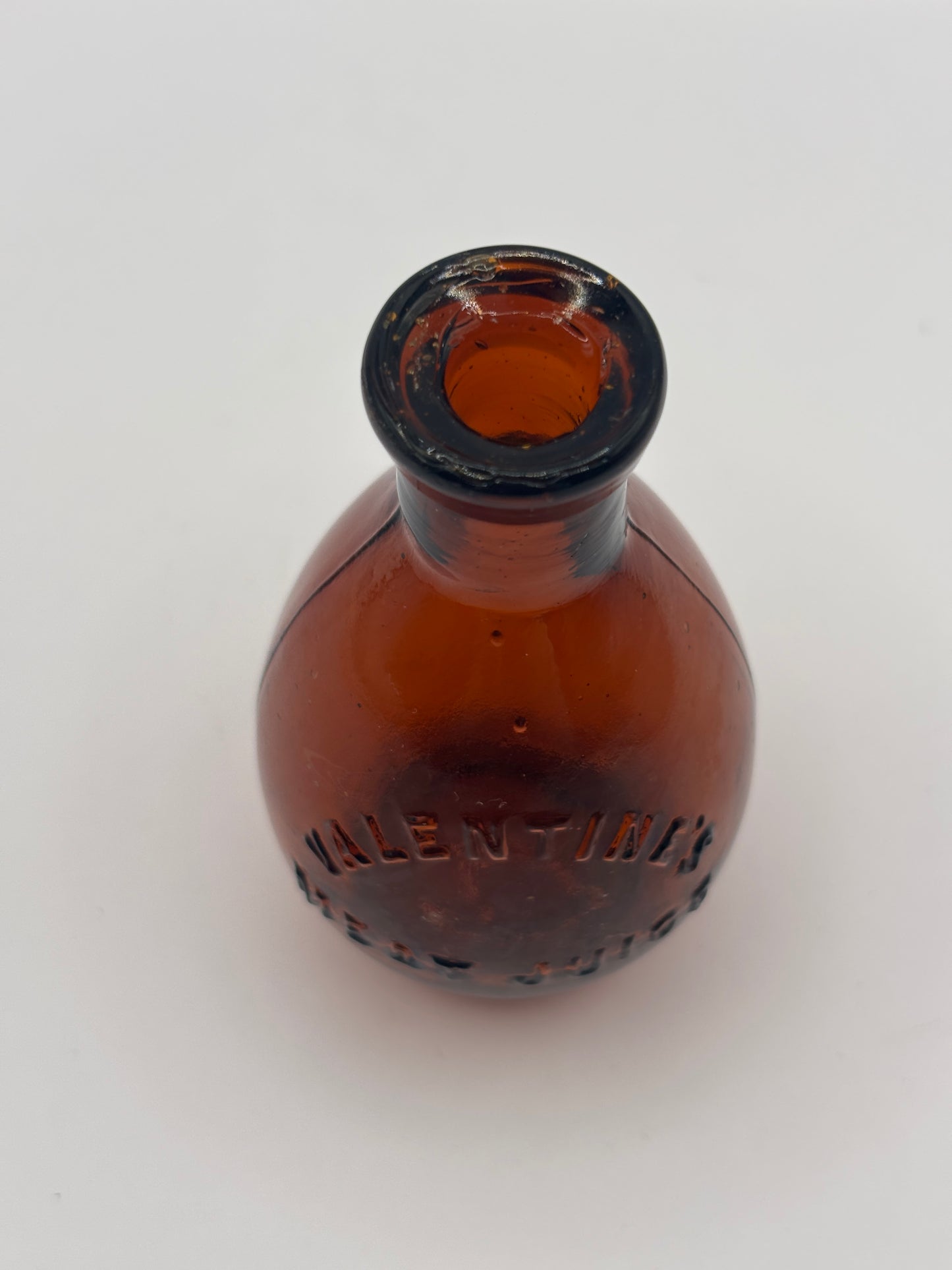Old amber glass bottle, valentines meat juice