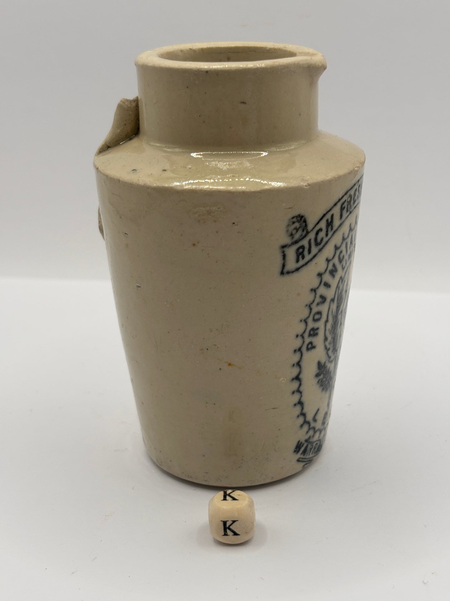 Old stoneware advertising cream pot. Provencial dairies Leeds (k) damaged