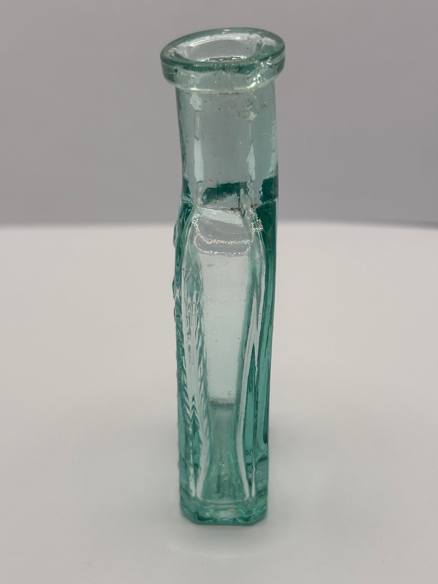 Old aqua glass advertising chemist bottle. Pritchards teething powder