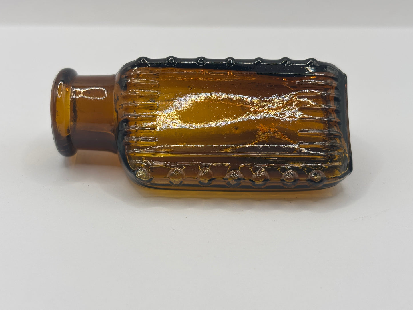 Old amber glass poison bottle