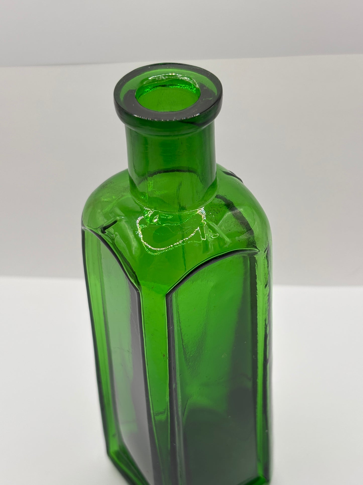 Old green glass Izal bottle