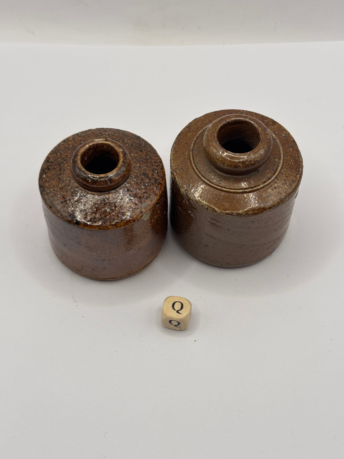 2 old brown stoneware ink bottles, inks. Pork pie ink (Q)