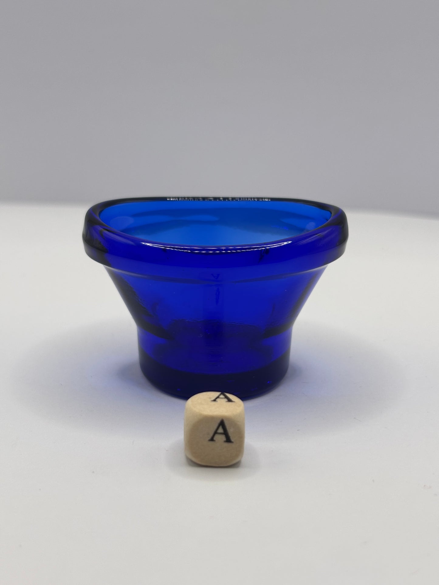 Old blue glass eye bath (a)