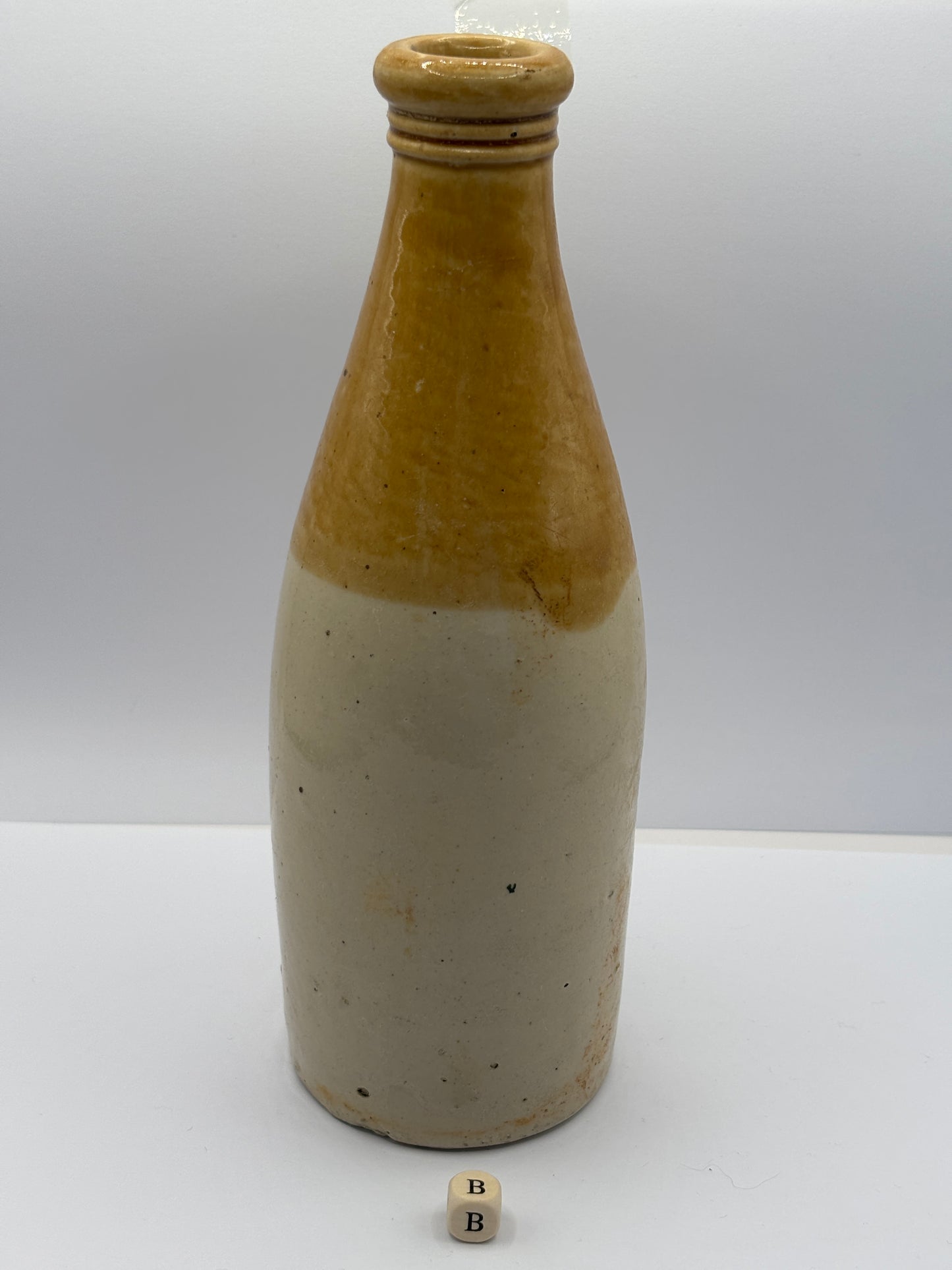 Old plain stoneware ginger beer bottle (B)