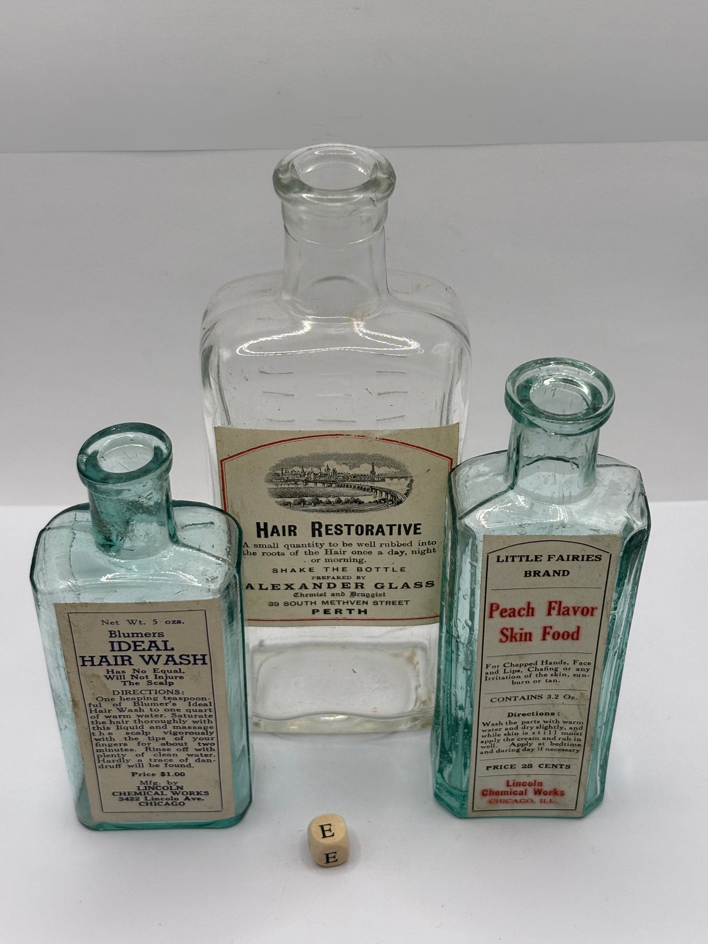 3 old chemist bottles with added labels (E)