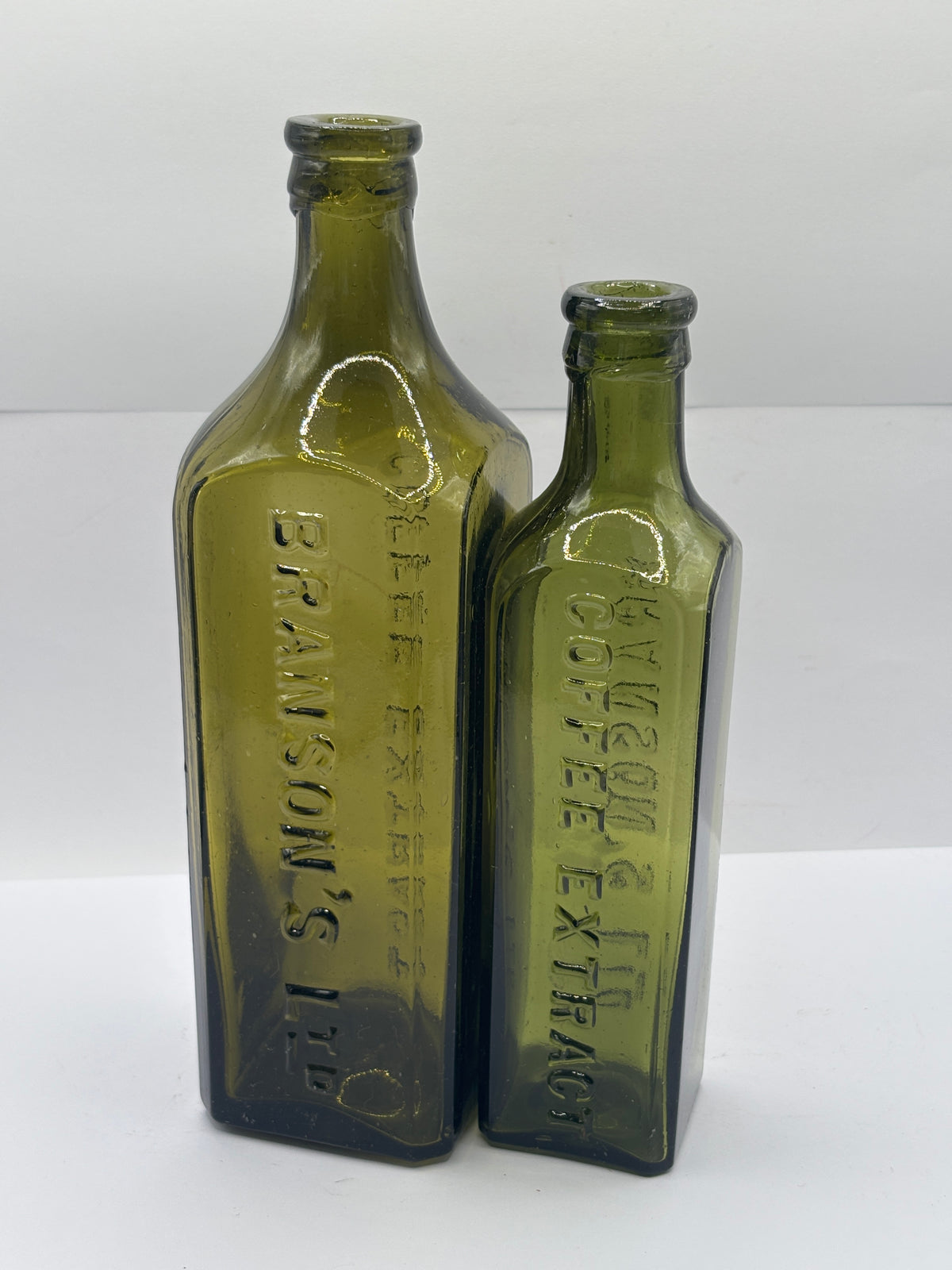 2 Old green glass Branston sauce bottles