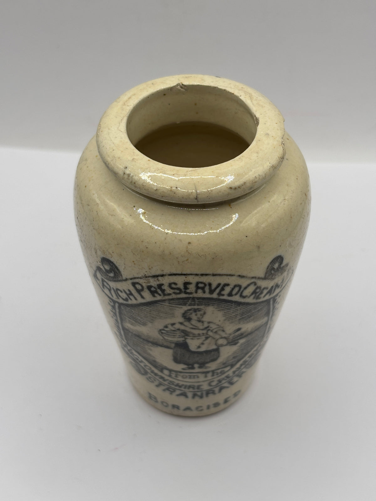 Old advertising cream pot, rich preserved cream stranraer, milkmaid. Damaged