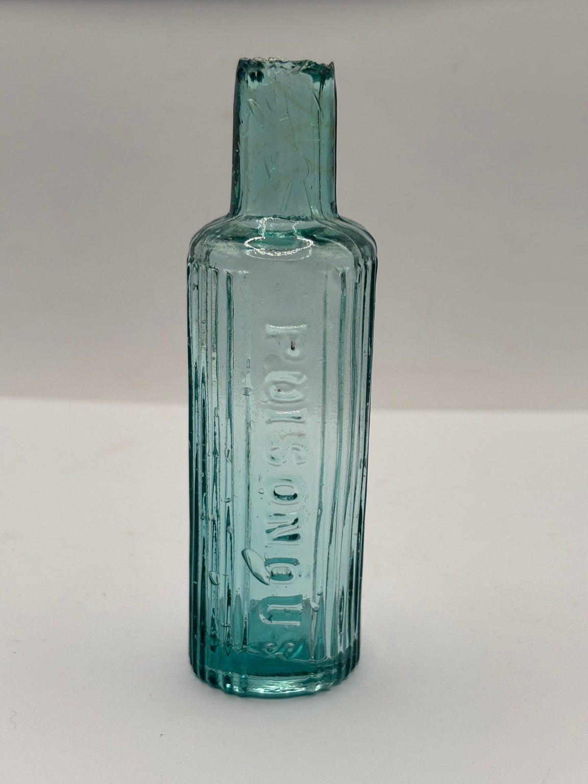 Old aqua glass poison bottle, POISONOUS not to be taken