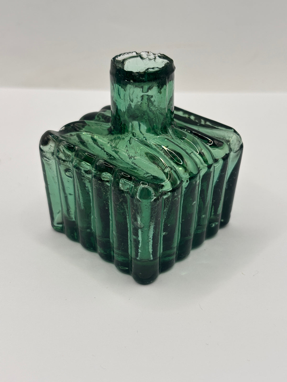 Old dark green glass inkwell, ink bottle, penny ink