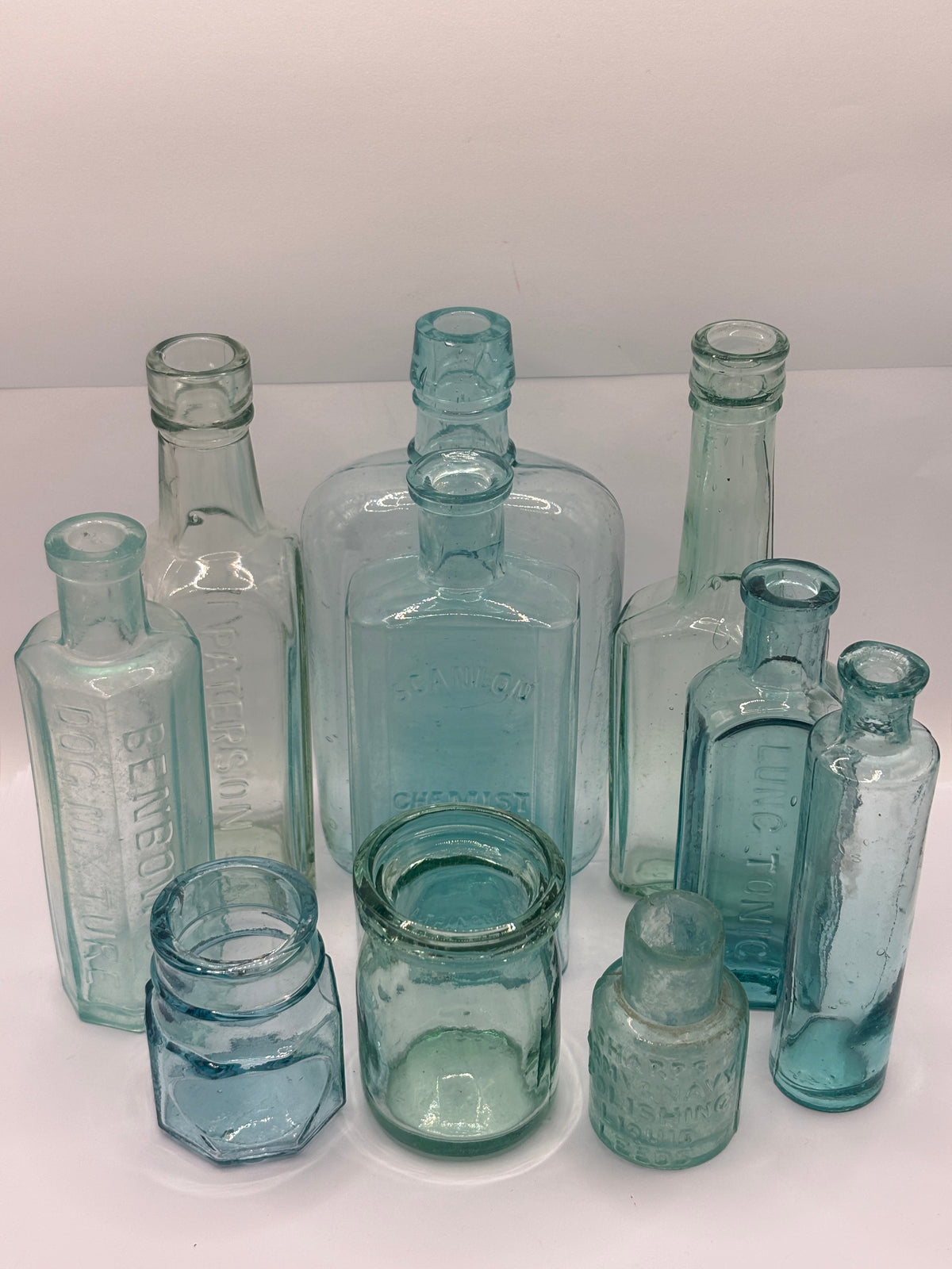10 Old aqua glass chemist bottles