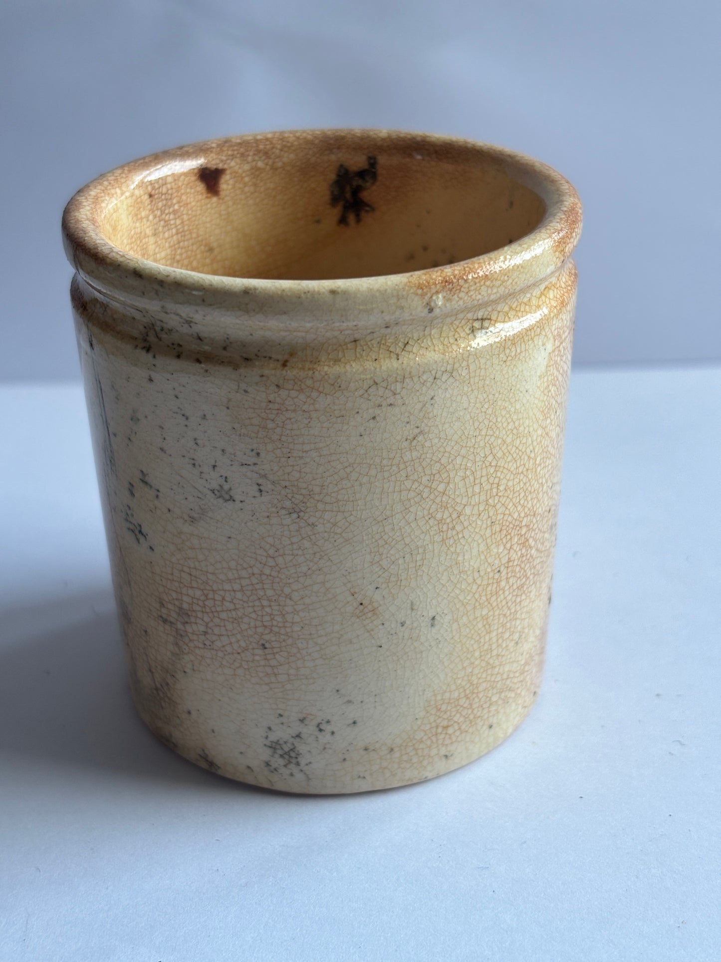 Old white stoneware pot, stained & crazed