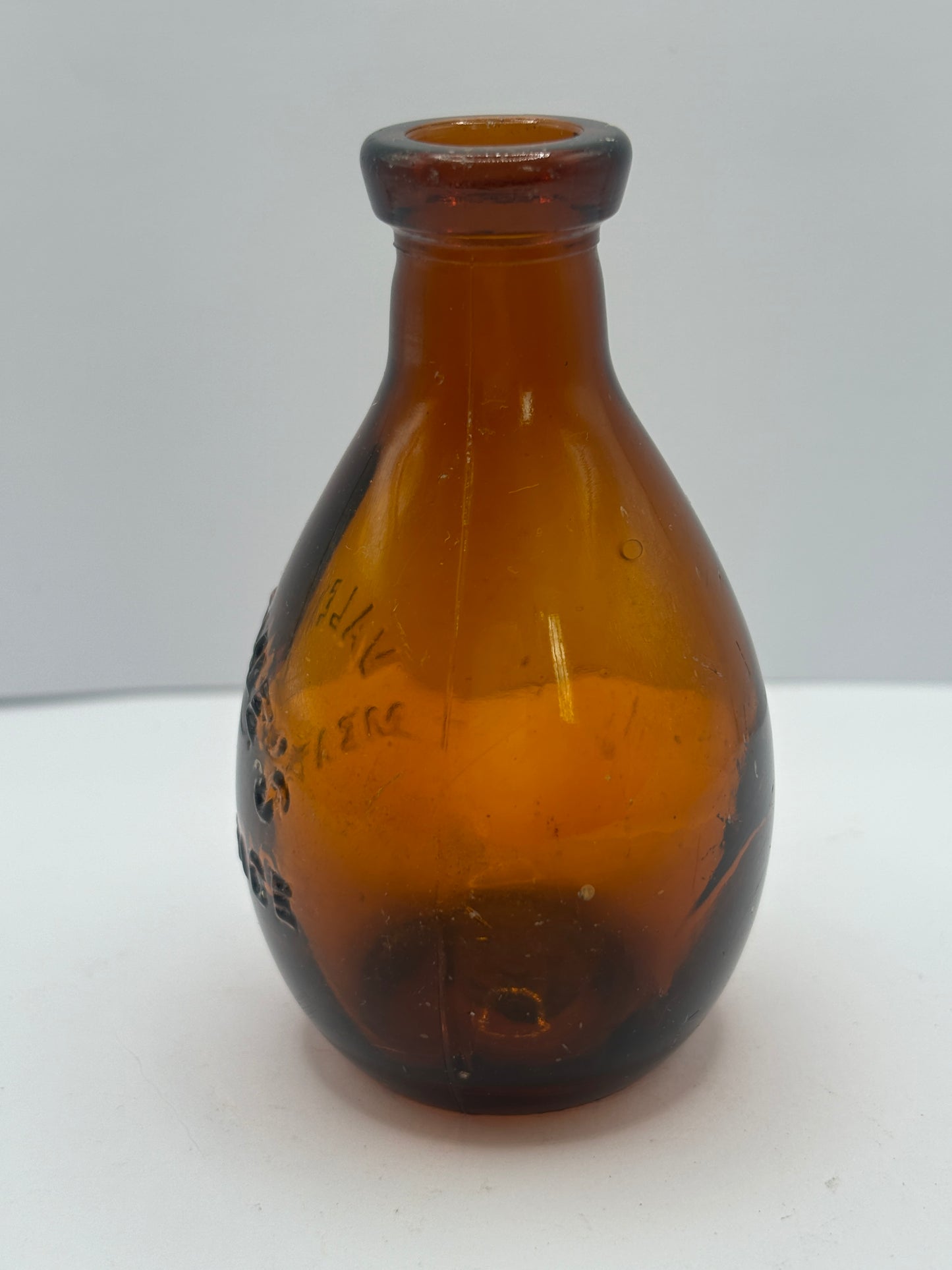 Small old amber glass valentines meat juices bottle