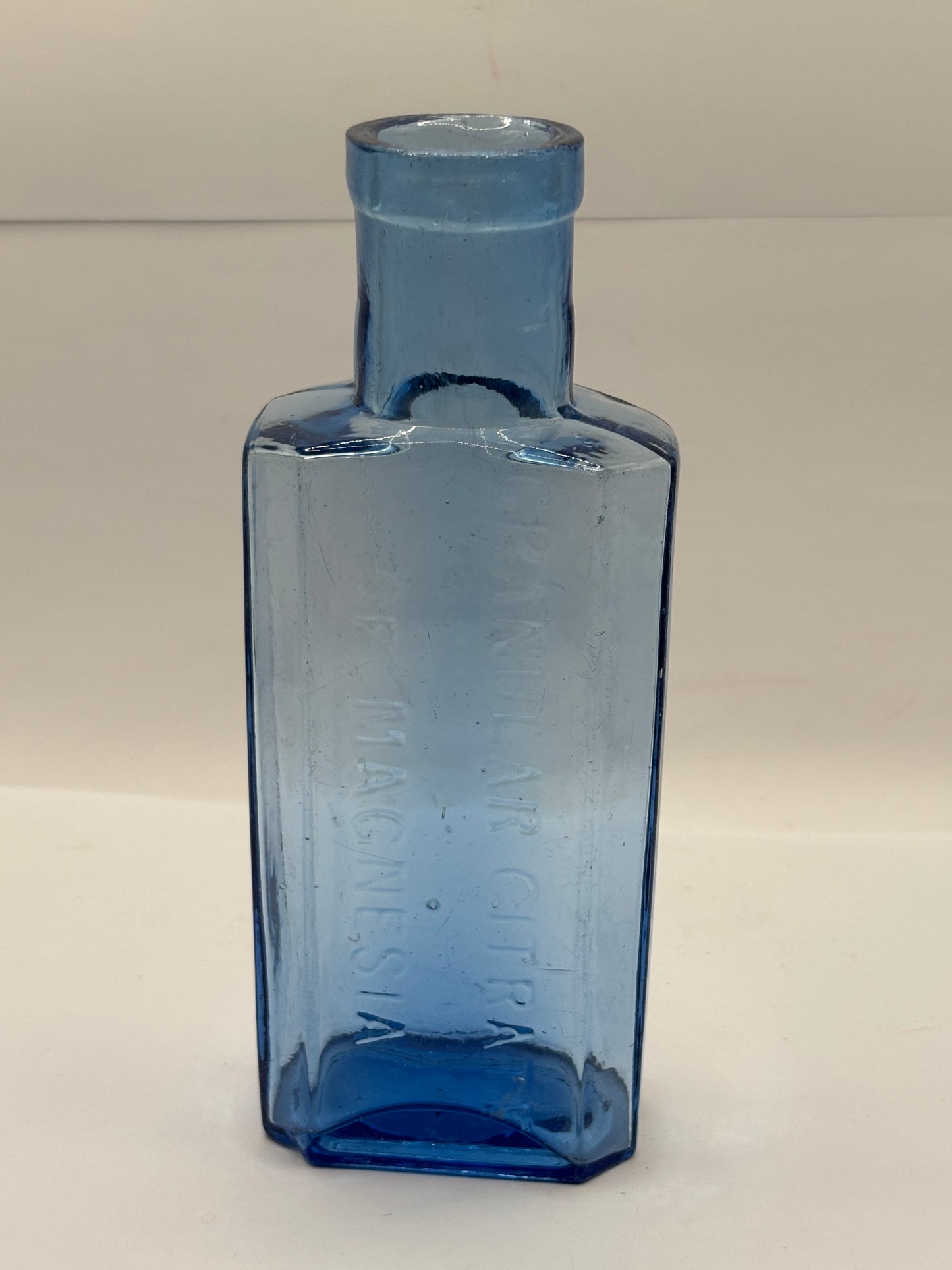Old blue glass advertising chemist bottle, Granular citrate of magnesia