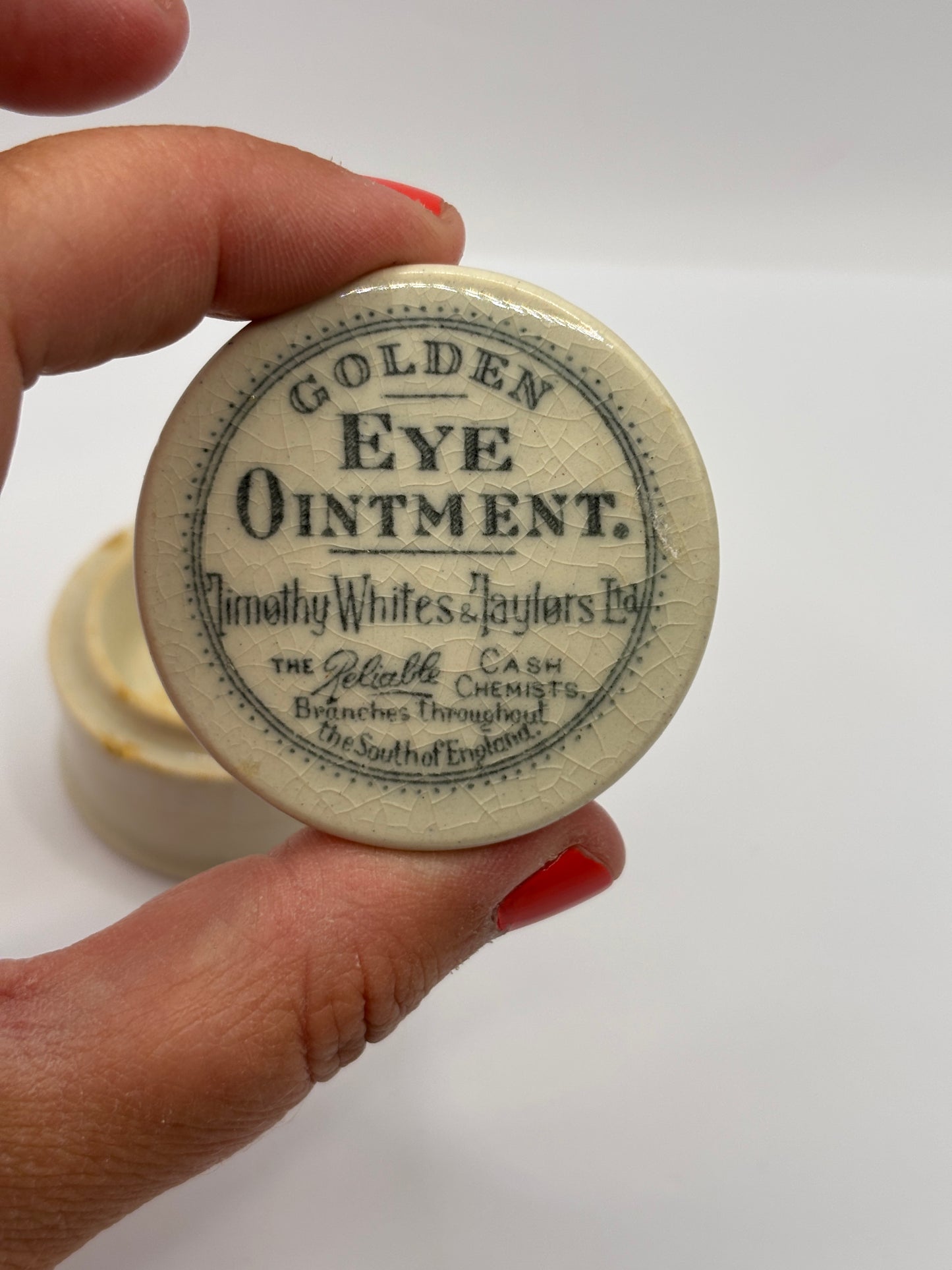 Old advertising lid and base, Timothy Whites Golden eye ointment
